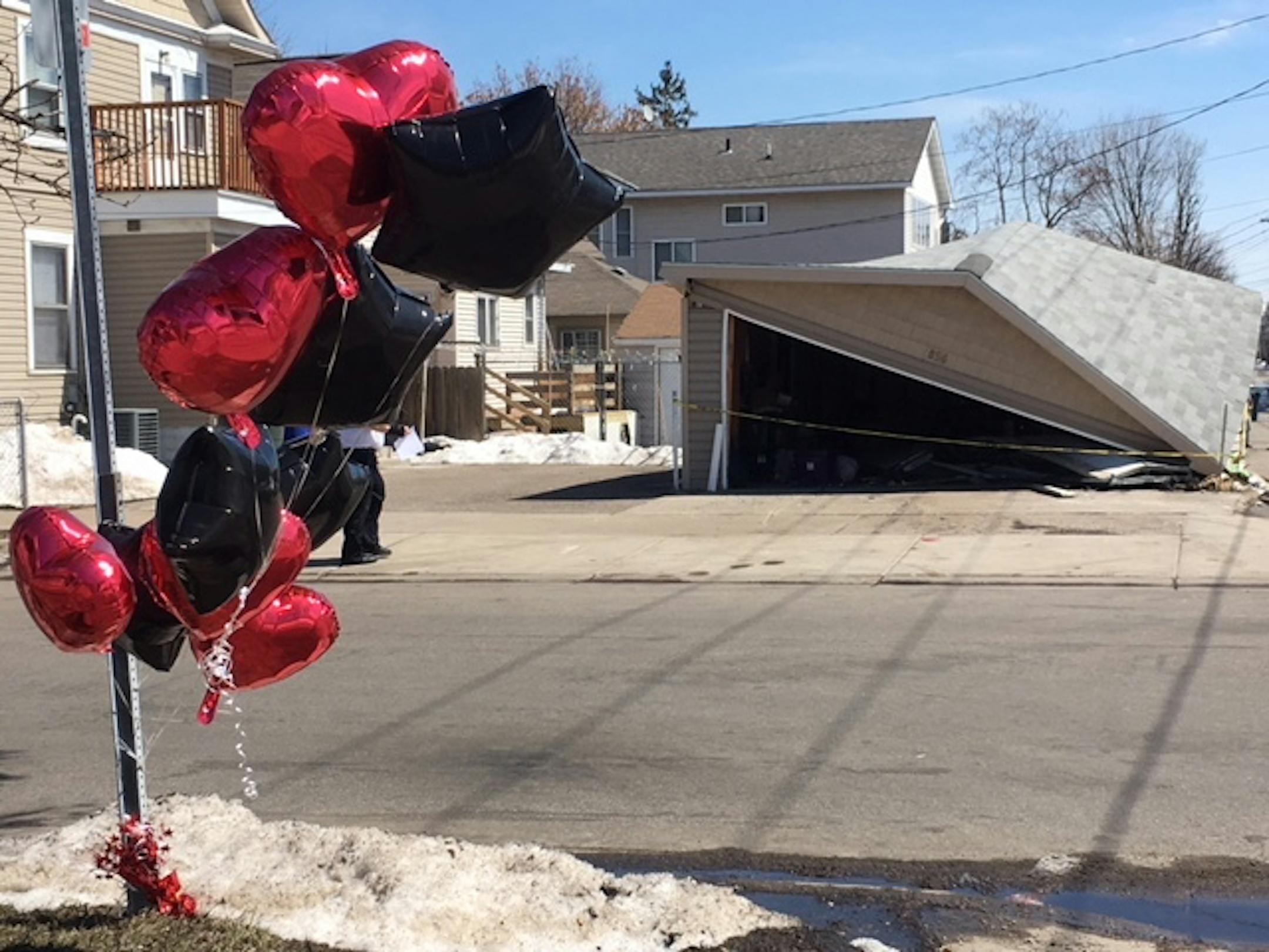 The scene of a violent crash late Friday in St. Paul that killed a 41-year-old driver passing by and injured a suspect fleeing police. The crash also destroyed a garage in the 800 block of Sherburne Avenue.
