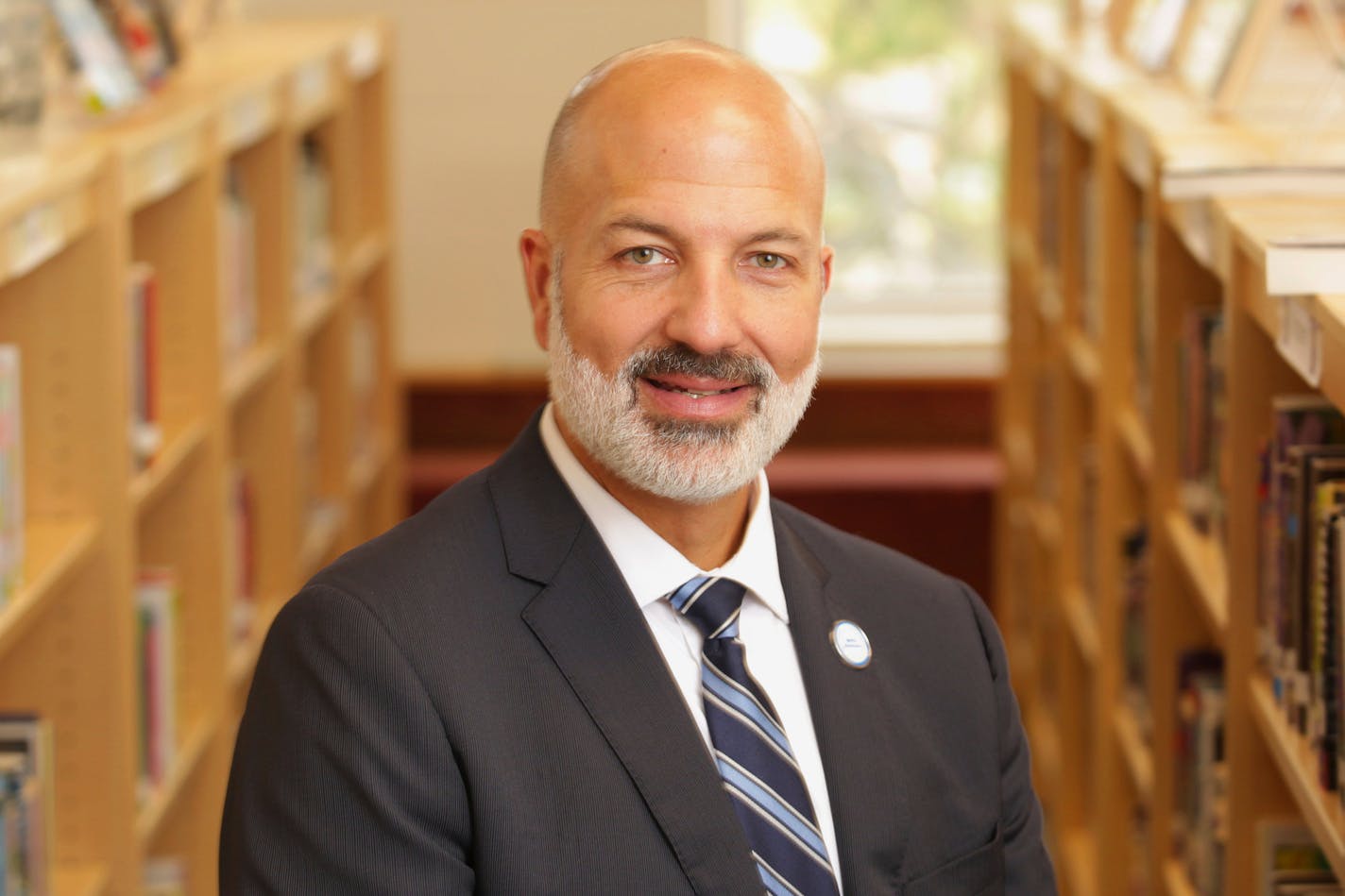 St. Paul public school Superintendent Joe Gothard stands for a portrait at Como Park High School in St. Paul, Minn., on Saturday, Aug. 21, 2021, where new federal school funding will help to hire staff, buy books and be used for building renovations. "It's about managing expectations, honestly, and it starts with myself. We really have to be careful about avoiding a financial cliff." (AP Photo/Andy Clayton-King)