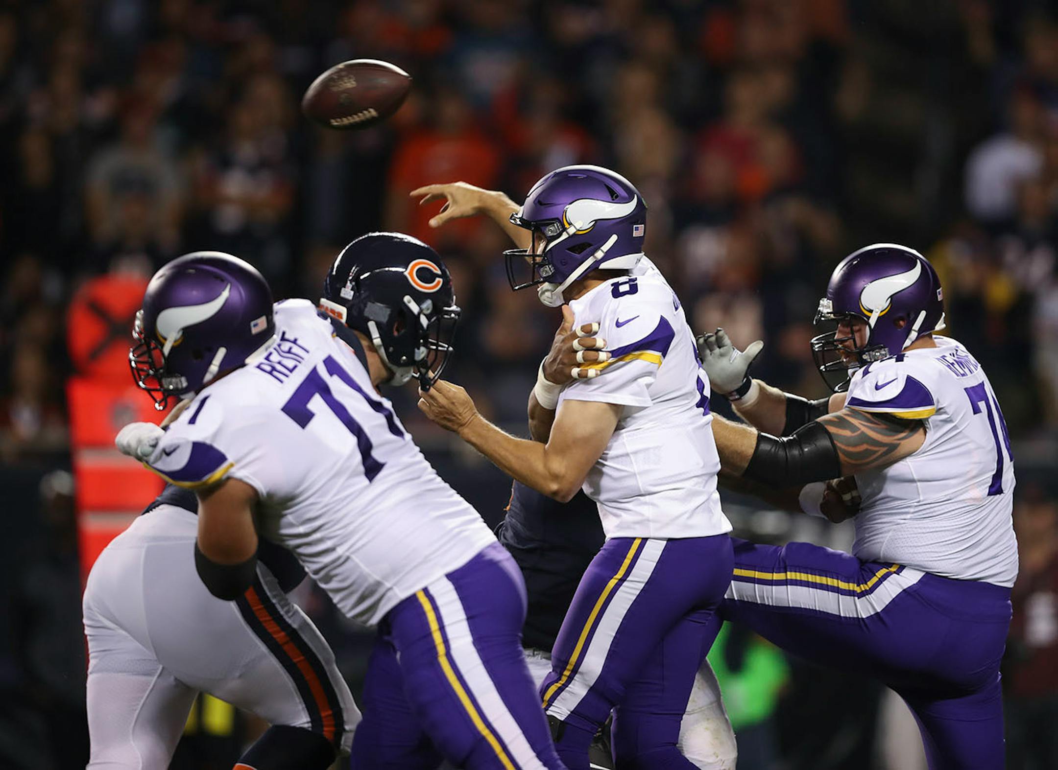 Minnesota Vikings quarterback Sam Bradford (8) was pressured by Chicago Bears defensive end Akiem Hicks (96) in the first quarter.