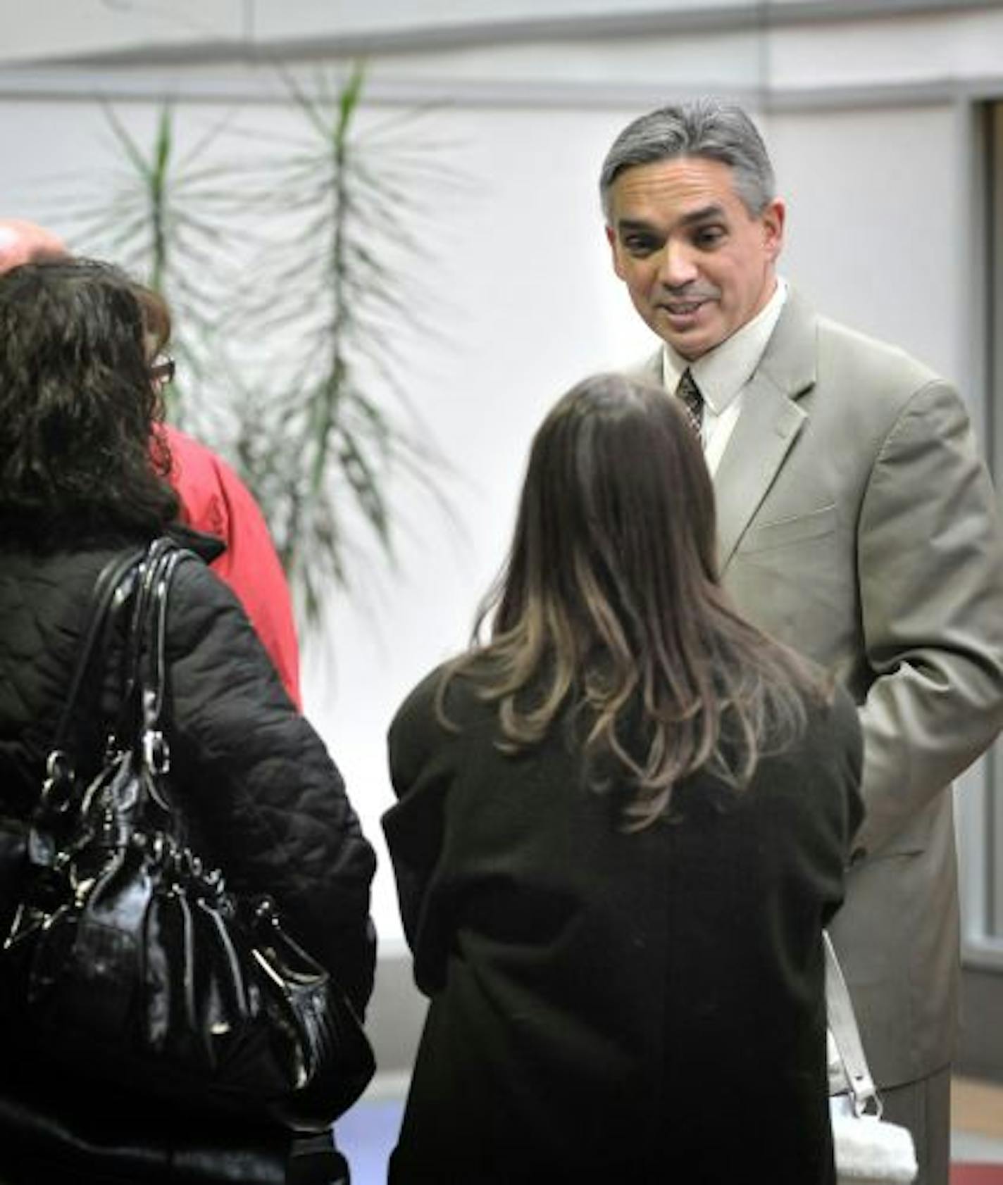 Newly hired Inter-Mark Corp CEO Bob Kinsella stood outside iNetGlobal, V-Local and V-Webs offices talking with employees as Secret Service agents searched for evidence in what authorities are calling a suspected Ponzi scheme.