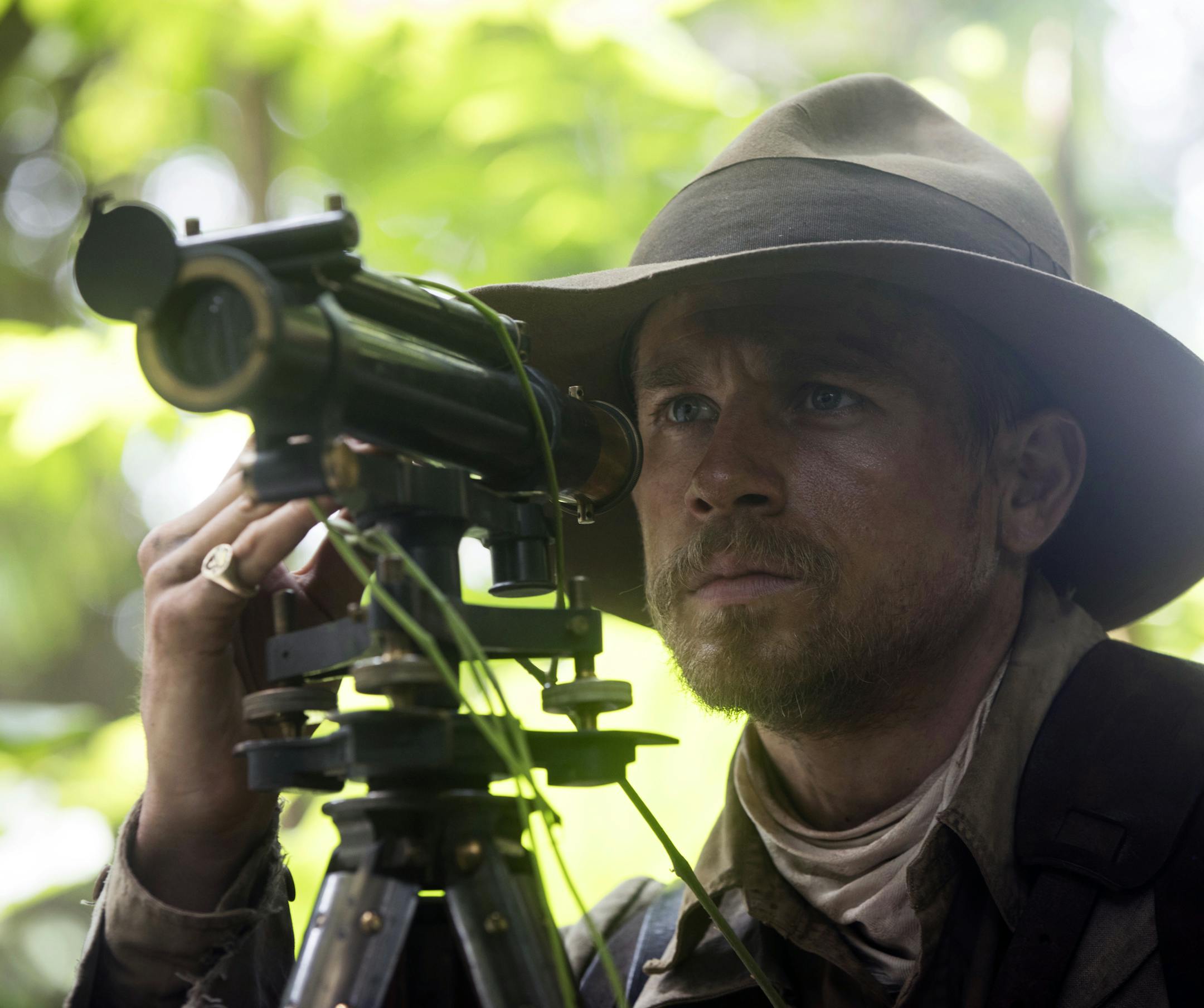 This image released by Amazon Studios/Bleecker Street Films shows Charlie Hunnam in a scene from "The Lost City of Z." (Aidan Monaghan/Amazon Studios/Bleecker Street via AP)