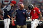 Minnesota Twins center fielder Byron Buxton (25) was checked by trainers after he was hit in the hand while batting in the sixth inning. ] ANTHONY SOU