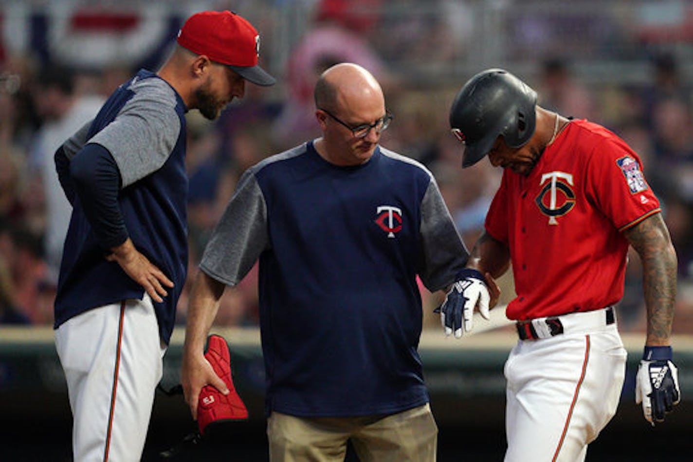 Minnesota Twins center fielder Byron Buxton (25) was checked by trainers after he was hit in the hand while batting in the sixth inning. ] ANTHONY SOUFFLE • anthony.souffle@startribune.com The Minnesota Twins played the Kansas City Royals in an MLB game Friday, June 14, 2019 at Target Field in Minneapolis.