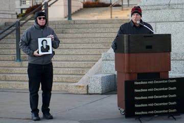 Former Secretary of State Mark Ritchie, right, remembered his daughter Rachel, who was killed by a drunk driver in 2000. A photo of Rachel is held up 