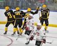 American International College players celebrated a goal during the second period of an NCAA men's Division I hockey tournament regional semifinal aga