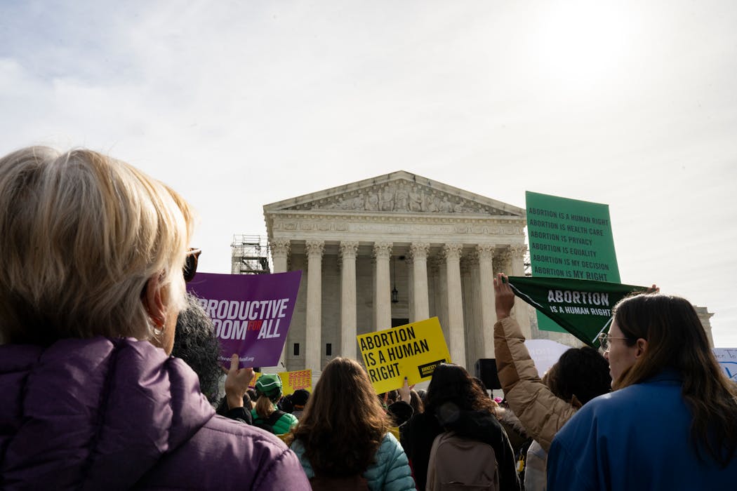 Abortion rights protesters gather outside the Supreme Court building, in Washington on March 26, 2024.