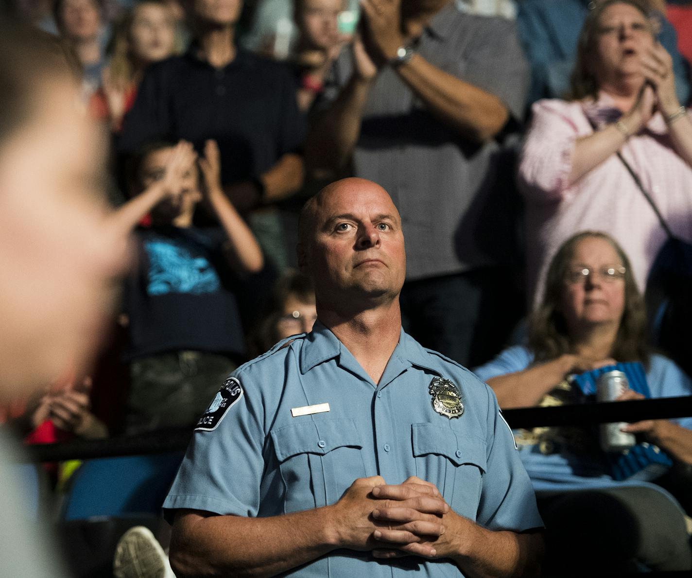 Minneapolis police officer Michael Osbeck looked towards the court as the Lynx's starting lineup is announced. ] Isaac Hale &#xef; isaac.hale@startribune.com The Minnesota Lynx took on the New York Liberty at the Target Center on Friday, July 15, 2016.