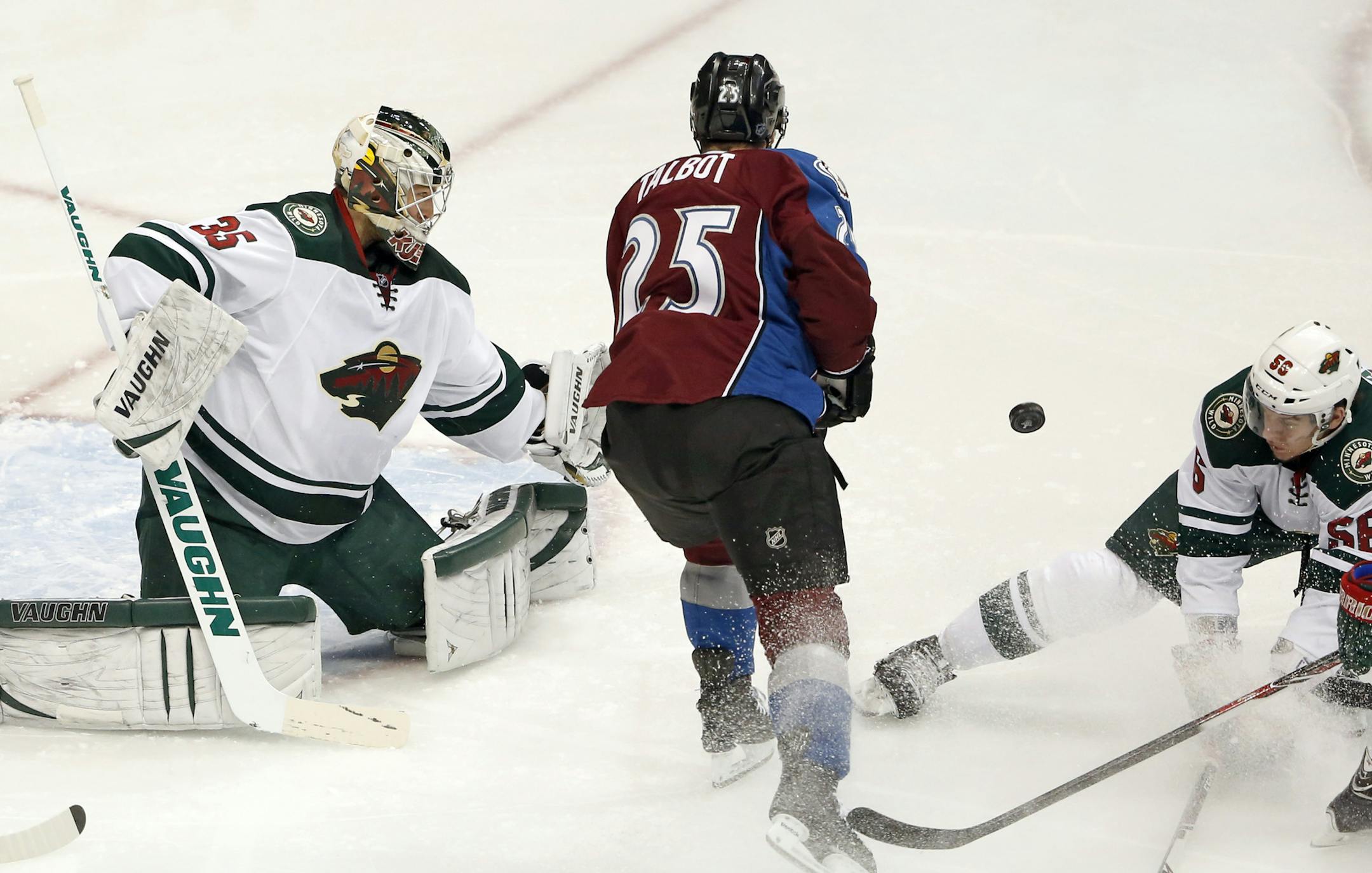 Minnesota Wild goal keeper Darcy Kuemper defends the goal as teammate Marco Scandella battles the Colorado Avalanche's Maxime Talbot during the first period of play Wednesday during game 7 of the first round of the Stanley Cup Playoffs, Wednesday at the Pepsi Center in Denver, Colorado. ] CARLOS GONZALEZ cgonzalez@startribune.com - April 30, 2014, Denver, Colorado, Pepsi Center, NHL, Minnesota Wild vs. Colorado Avalanche, Stanley Cup Playoffs round 1, Game 7