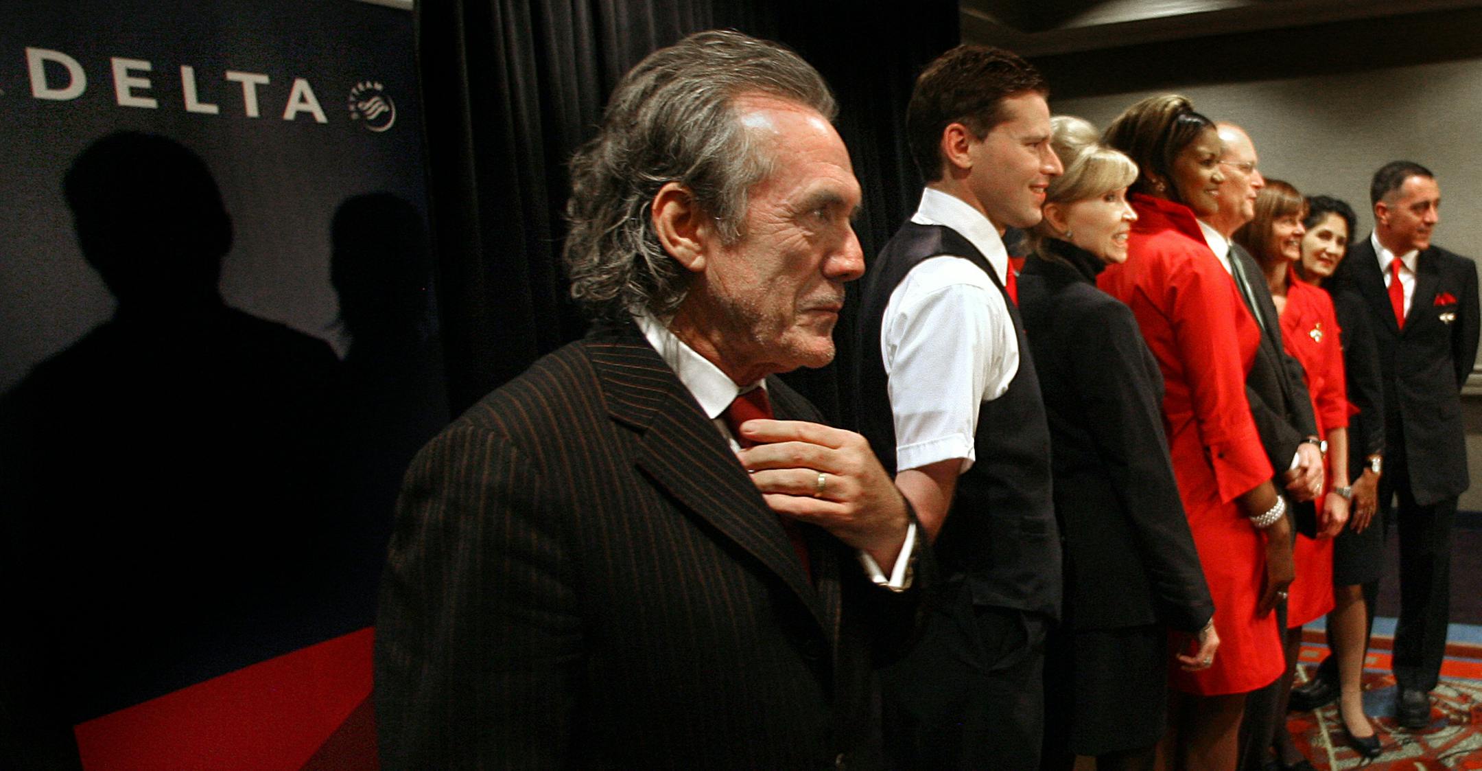 JIM GEHRZ � jgehrz@startribune.comBloomington/November 21, 2008/9:30 AMFashion designer Richard Tyler (left) created a line of uniforms exclusively for Delta Airlines. He recently provided personal style consultations to Northwest Airlines flight attendance during a uniform fitting session.