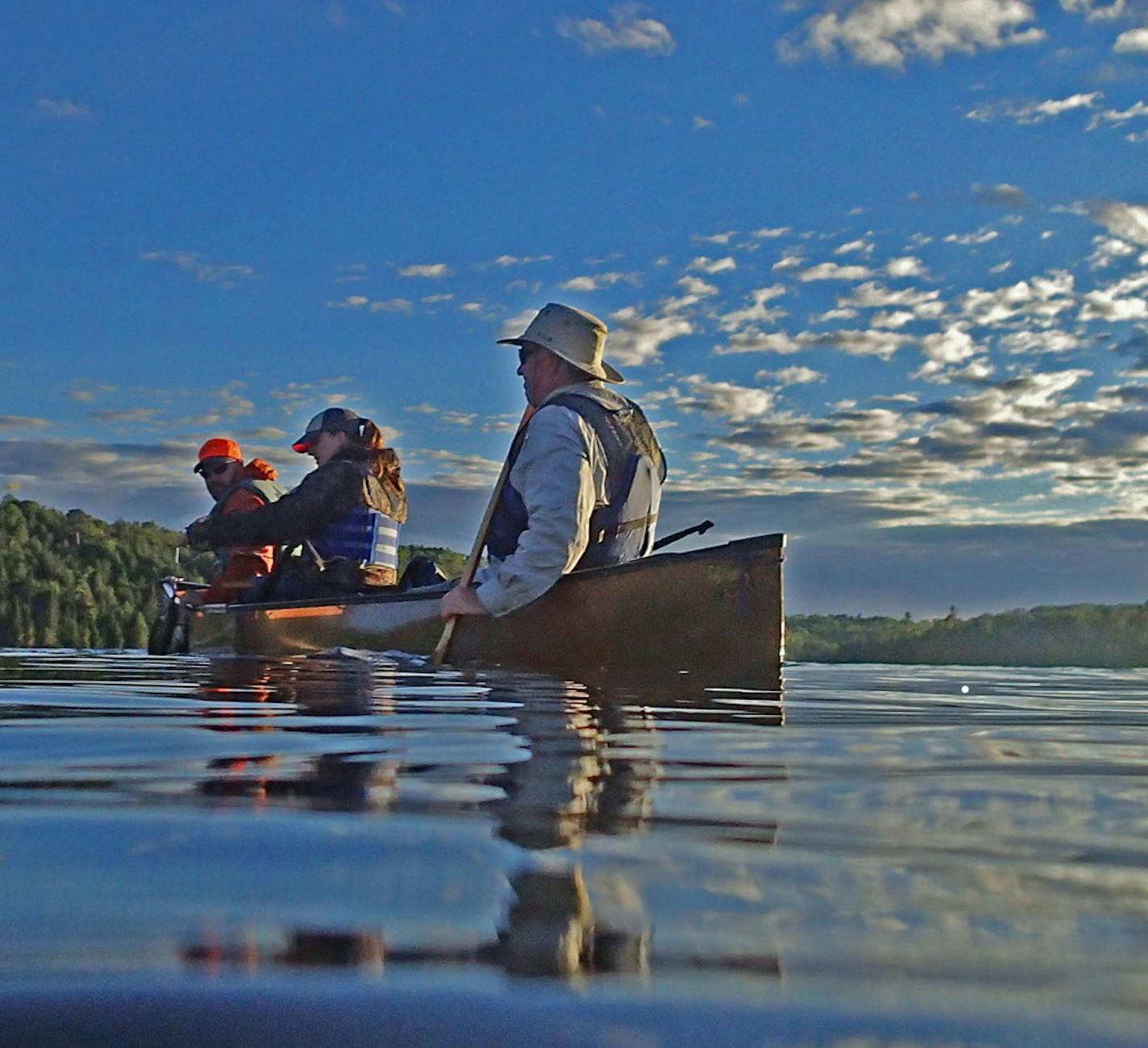 On a beautiful summer evening in the Boundary Waters Canoe Area Wilderness, a canoe full of anglers appeared as if a painting. ORG XMIT: MIN1407171403251819