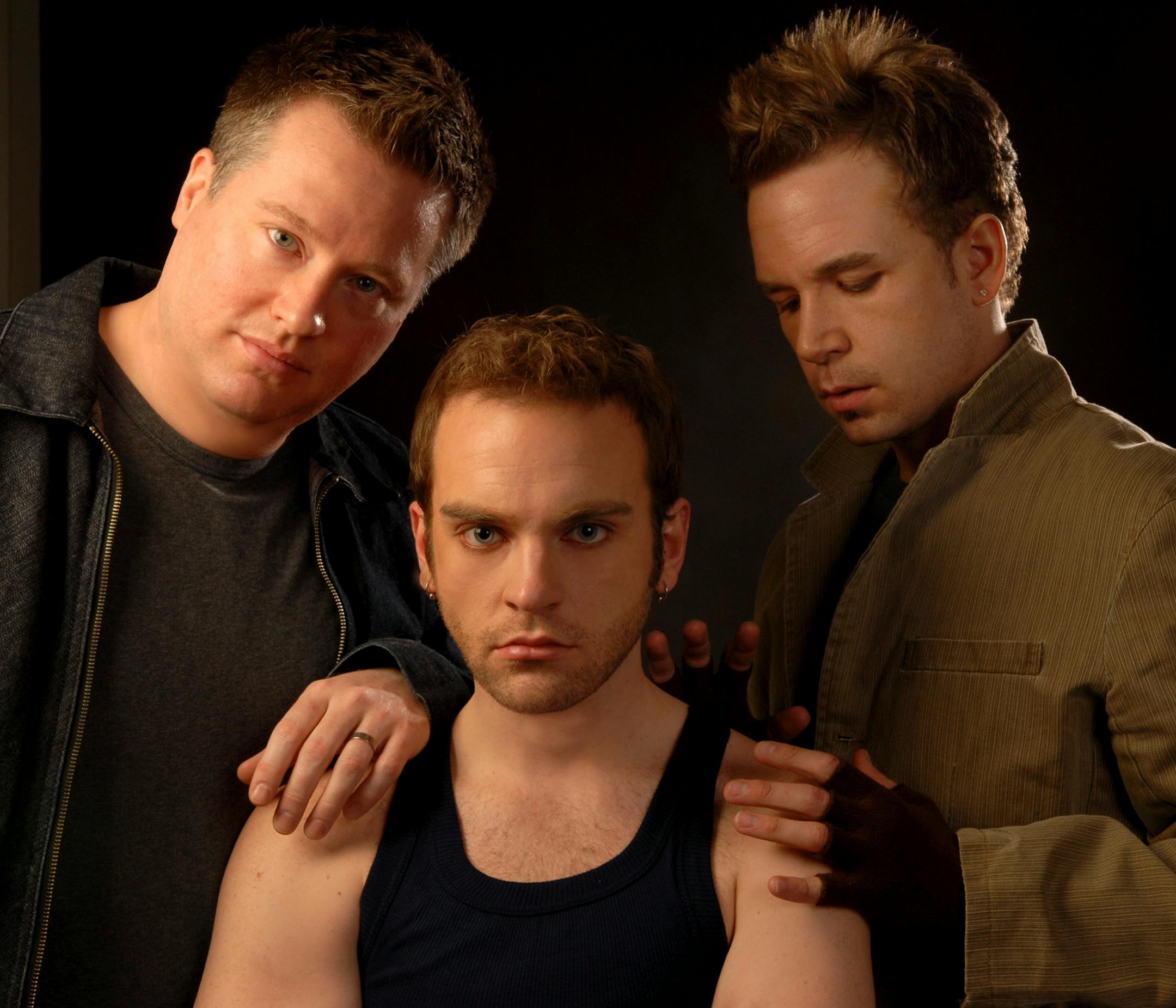 Photo credit : Paul Nixdorf soloists left to right, Bryan Fisher ( Zack), Paul Brekke ( Sebastian) and Justin Scharr ( Billy) performing with the Twin Cities gay Mens Chorus wourld premiere of " Through a Glass, Darkly' - accompanies clas0323'