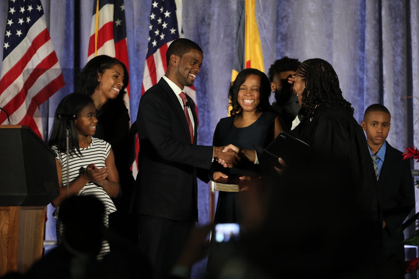 Melvin Carter is congratulated after being sworn in Tuesday as St. Paul's new mayor.