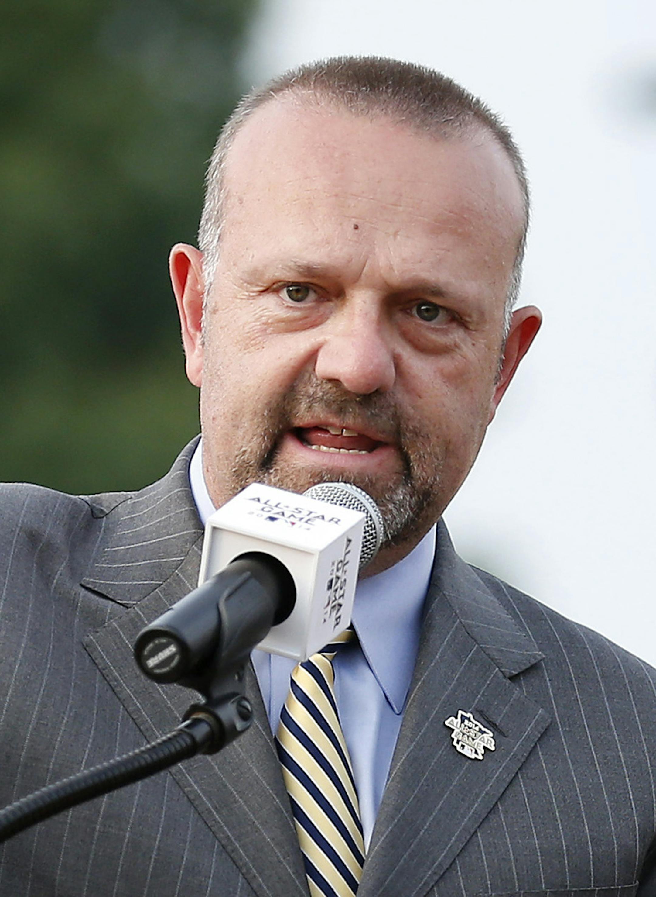 Minnesota Twins President Dave St. Peter presented Star Tribune spots columnist Sid Harman with a plaque during a dedication ceremony in his honor. Northeast Park in Minneapolis has been renamed Sid Hartman All Star Field. ] CARLOS GONZALEZ cgonzalez@startribune.com - July 10, 2014 , Minneapolis, Minn., NE Park Field is being renamed after Star Tribune Sports Columnist Sid Hartman. There is a special dedication. ORG XMIT: MIN1407102046550996 ORG XMIT: MIN1407181854543596