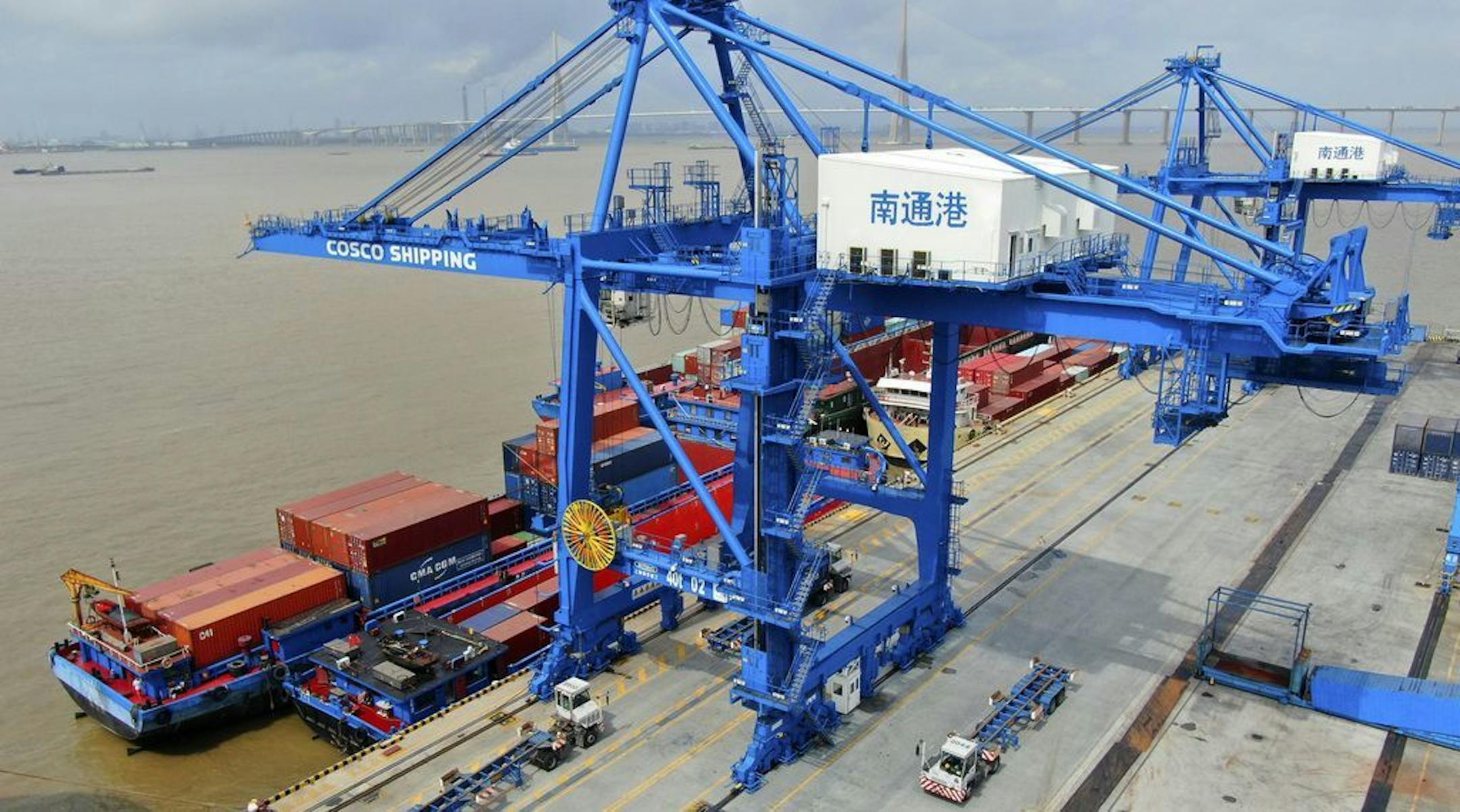 In this July 18, 2019, photo, shipping containers are loaded onto a cargo ship at a port in Nantong in eastern China's Jiangsu province. President Donald Trump intensified pressure on China to reach a trade deal by saying he will impose 10% tariffs Sept. 1 on the remaining $300 billion in Chinese imports he hasn't already taxed.