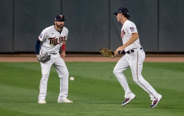 Twins outfielders Jake Cave and Max Kepler watched the ball fall out of Kepler's glove in the ninth inning, an error that led to three unearned White 