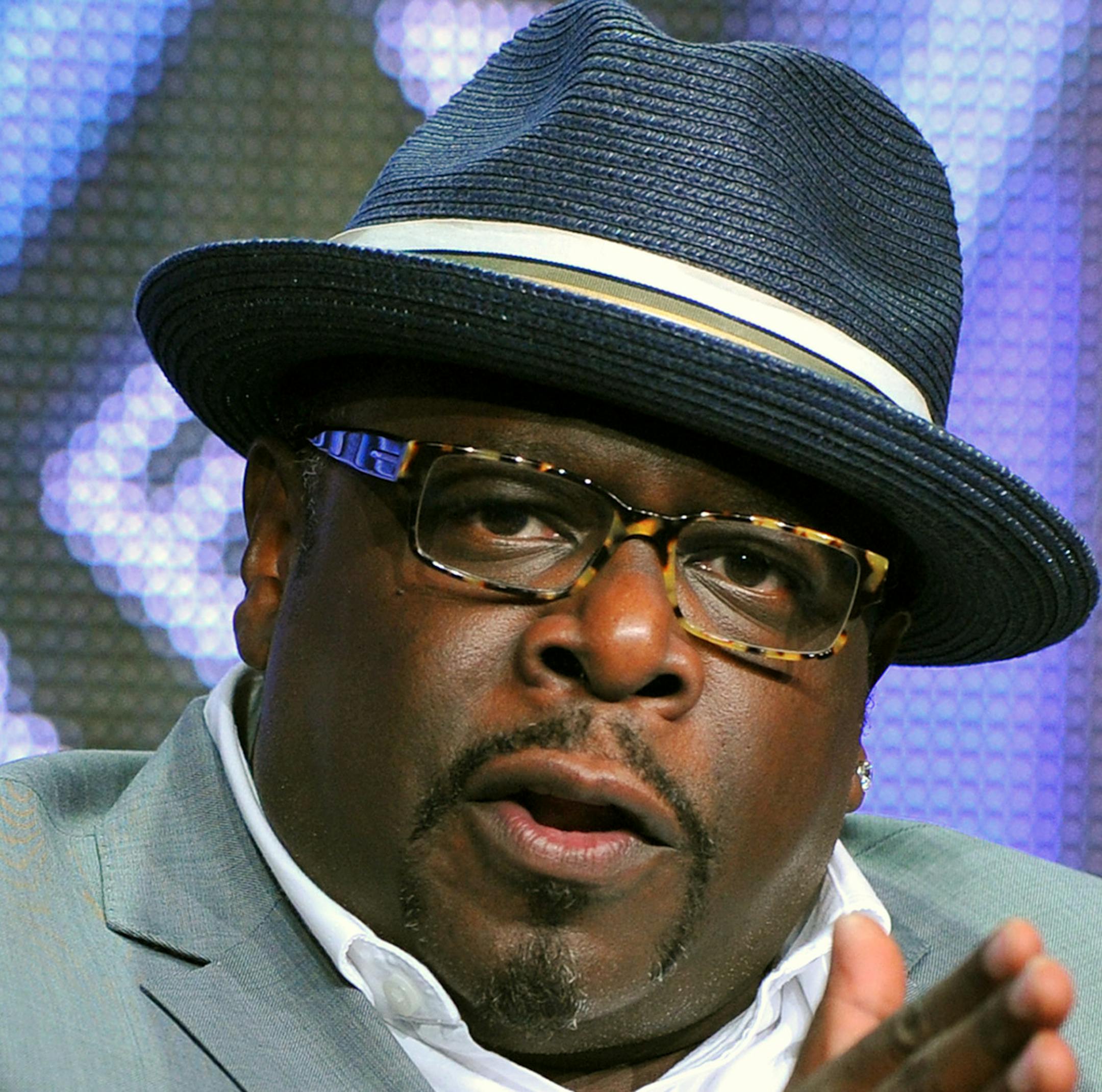 FILE - This Aug. 4, 2013, file photo, shows game show host Cedric "The Entertainer" of "Who Wants To Be A Millionaire" at the Disney/ABC Television Group's 2013 Summer TCA panel in Beverly Hills, Calif. On Sept. 2, the new season premieres, ushering in Cedric "The Entertainer" as host. (Photo by Vince Bucci/Invision/AP, File) ORG XMIT: MIN2013090414561849