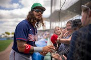 Minnesota Twins infielder Austin Martin signed autographs before the game.