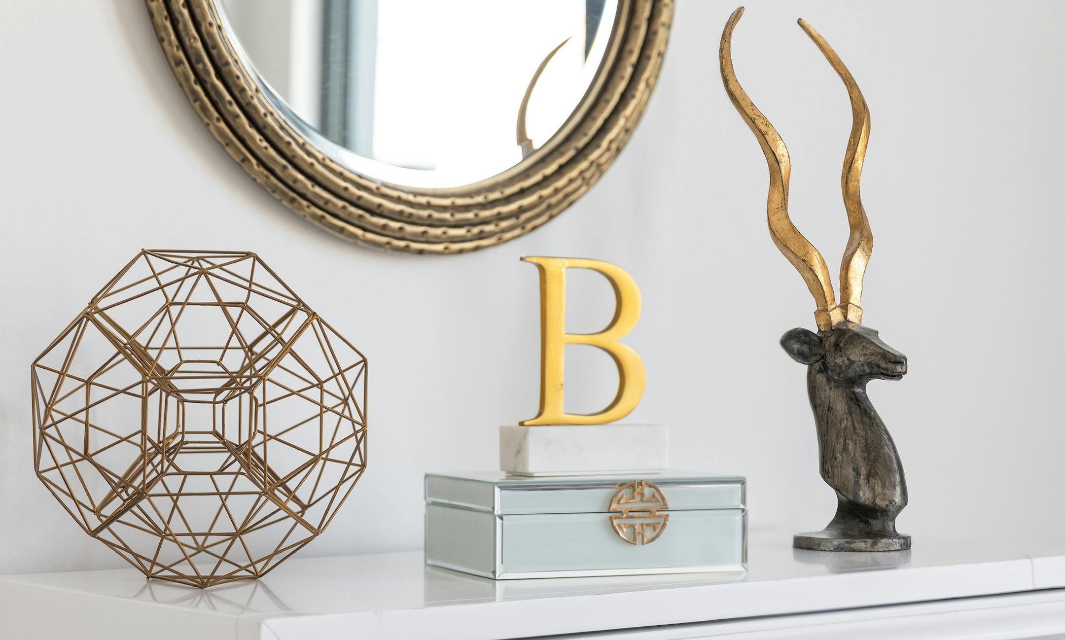Metallic and bronze accents serve as the perfect complement when paired with white.