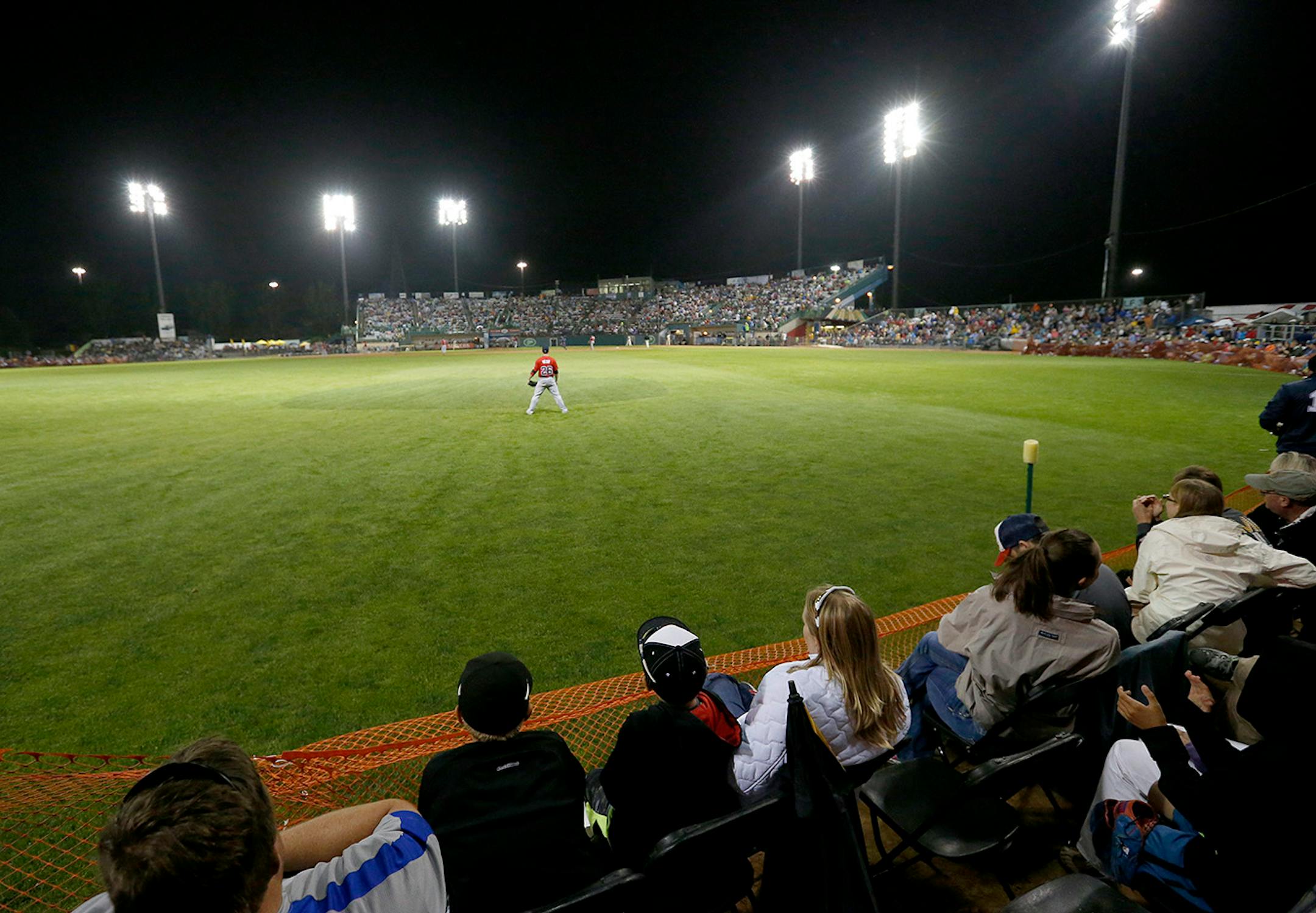 Fans watched the game from folding chairs placed on the warning track in the outfield during the St. Paul Saints final game at Midway Stadium on Thursday night. ] CARLOS GONZALEZ cgonzalez@startribune.com - August 28, 2014, St. Paul, Minn., Midway Stadium, St. Paul Saints baseball vs. Winnipeg - Final Saints game at Midway Stadium