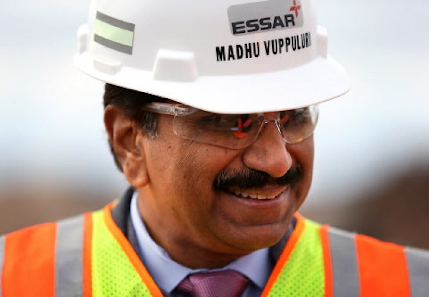 Madhu Vuppuluri, president and CEO of Essar Steel Minnesota, looks over the Essar Project in Nashwauk, Minn. Essar Steel Minnesota recently ramped up construction on an $1.8 billion taconite plant after securing the funding needed to complete the project. ] LEILA NAVIDI leila.navidi@startribune.com / BACKGROUND INFORMATION: Thursday, October 30, 2014. The plant endured several delays over the past two years as funds periodically ran dry and some contractors were paid late and walked off the job.