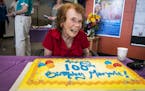 Marjorie Johnson sits in front of her birthday cake. Johnson, who allows herself 150 calories of sweets per day, enjoyed a tiny slice with coffee.
