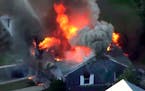 In this image take from video provided by WCVB in Boston, flames consume a home in Lawrence, Mass, a suburb of Boston, Thursday, Sept. 13, 2018. Emerg