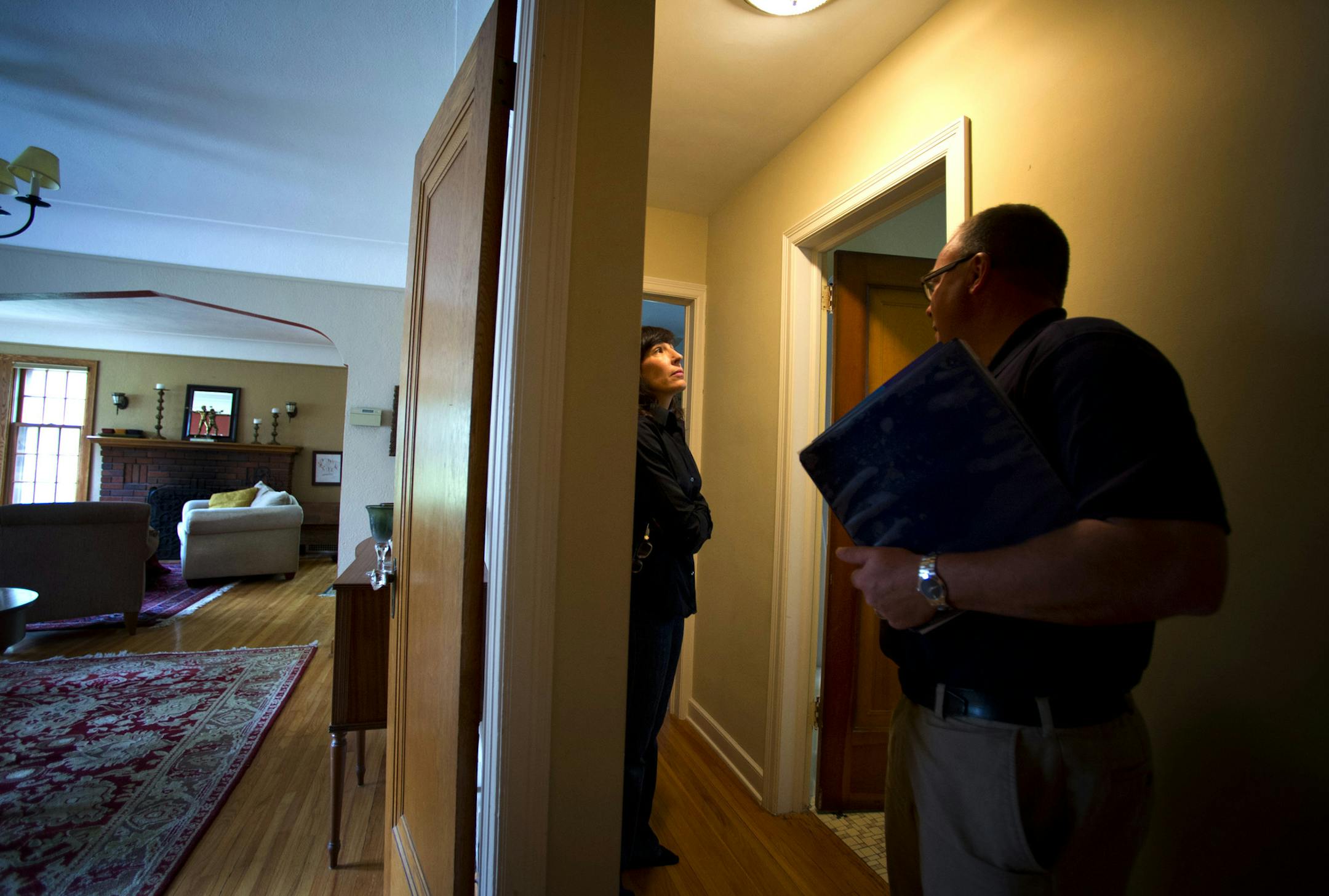Frank Parsons, property manager from 33rd Company did an initial walk through with Tracy Wilborn in her Minneapolis home. She is deciding between selling her home or hiring 33rd Company to act as property manager and turn it into a rental property. Thursday, May 30, 2013 ] GLEN STUBBE * gstubbe@startribune.com