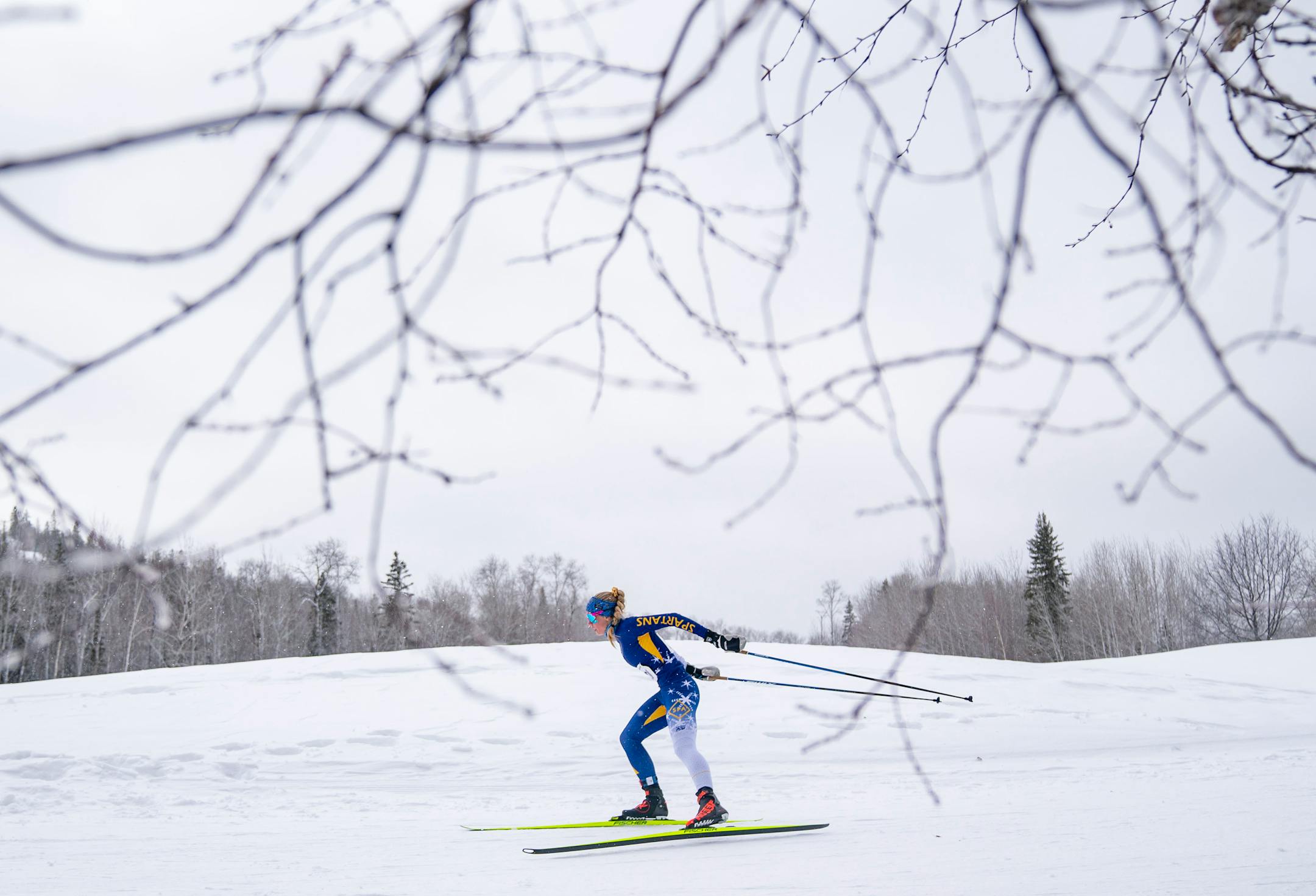 St. Paul Academy and Summit School nordic skier Helen Townley (20) competes in the girl's team sprint qualification race during the MSHSL Boys and Girls Nordic Ski Racing Meet.
