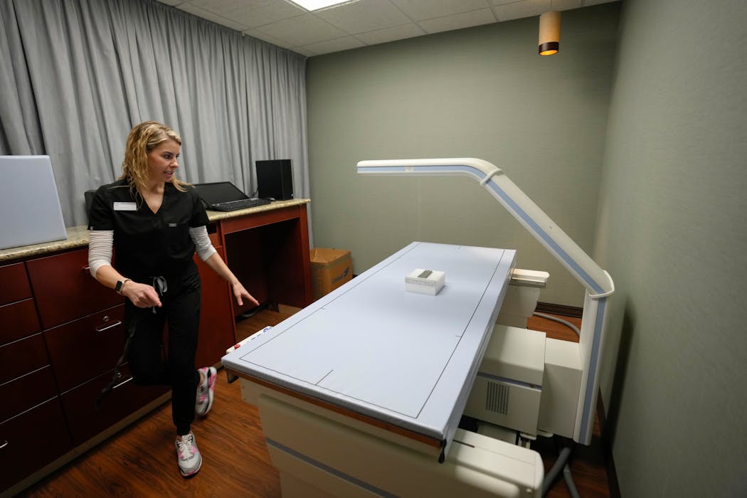 Life Time registered nurse and injections specialist Kylie Simko is pictured with the DEXA (Dual-Energy X-ray Absorptiometry) scan at the Miora clinic at the Life Time at Target Center in downtown Minneapolis. Miora offers a host of alternative therapies such as cryotherapy and also weight loss management such as Ozempic.