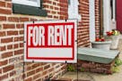 Red For Rent sign closeup against brick building. (Credit: Getty Images/iStockphoto) ORG XMIT: MIN1801191410370364