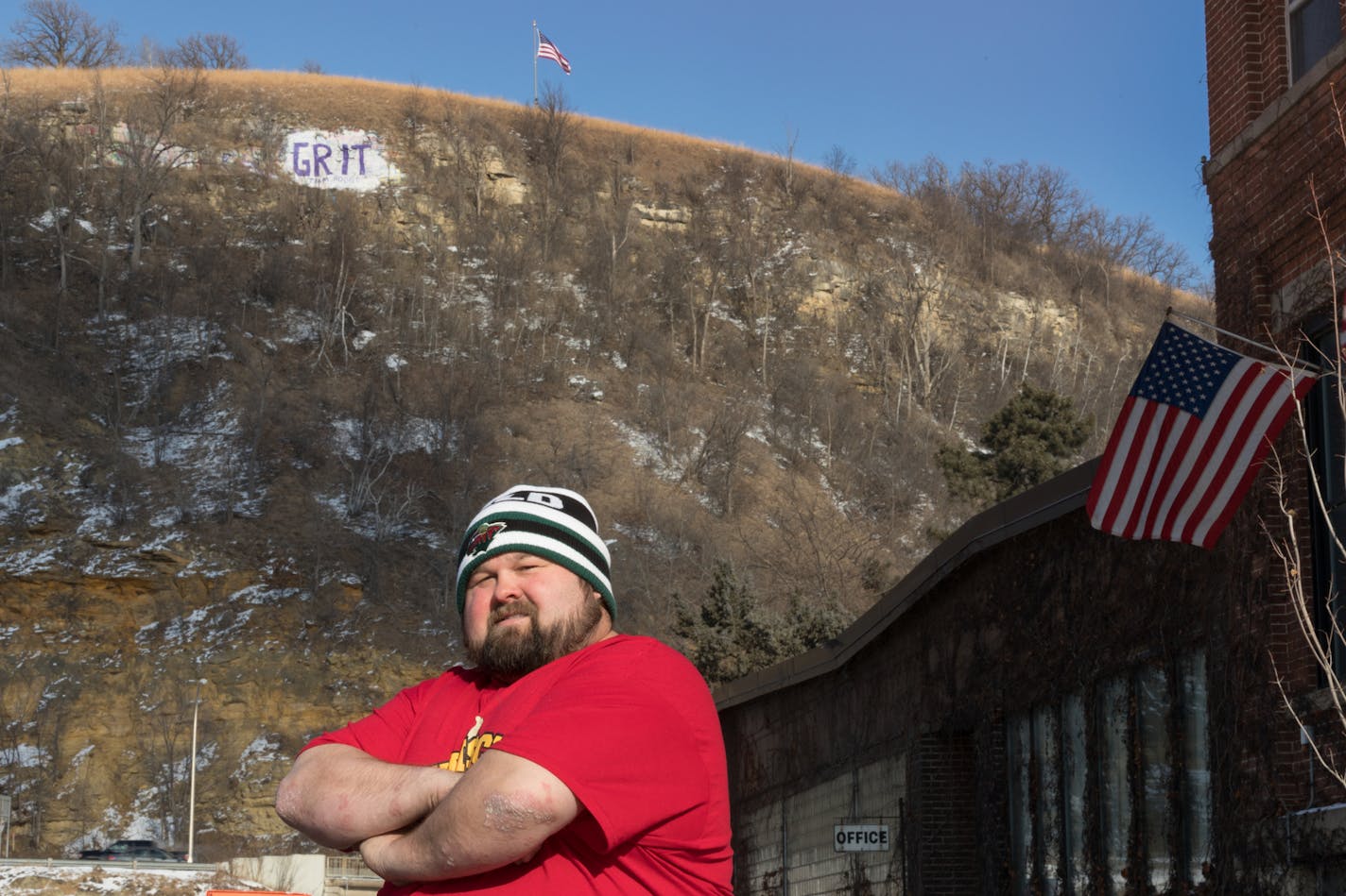 Bakery owner Bill Hanisch and his 13-year-old son, William (not pictured), painted the latest message on Barn Bluff: a memorial to Red Wing basketball coach Chris Rodgers, who died from a rare form of cancer.