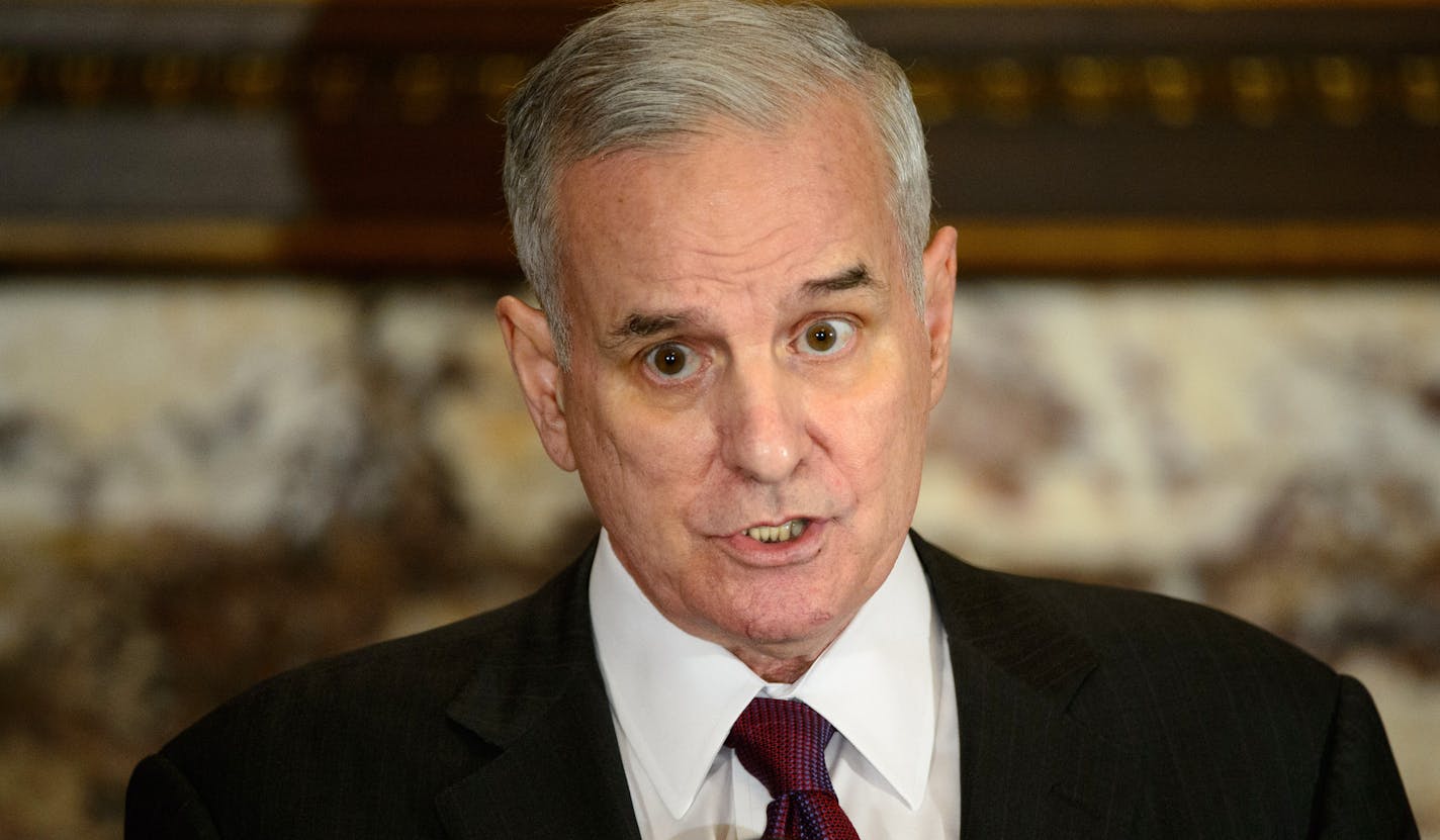 Governor Mark Dayton and Revenue Commissioner Myron Frans held a news conference to encourage taxpayers to file their taxes now. Commissioner Frans even placed a File Now sign on a poster. ] GLEN STUBBE * gstubbe@startribune.com Wednesday, April 2, 2014.