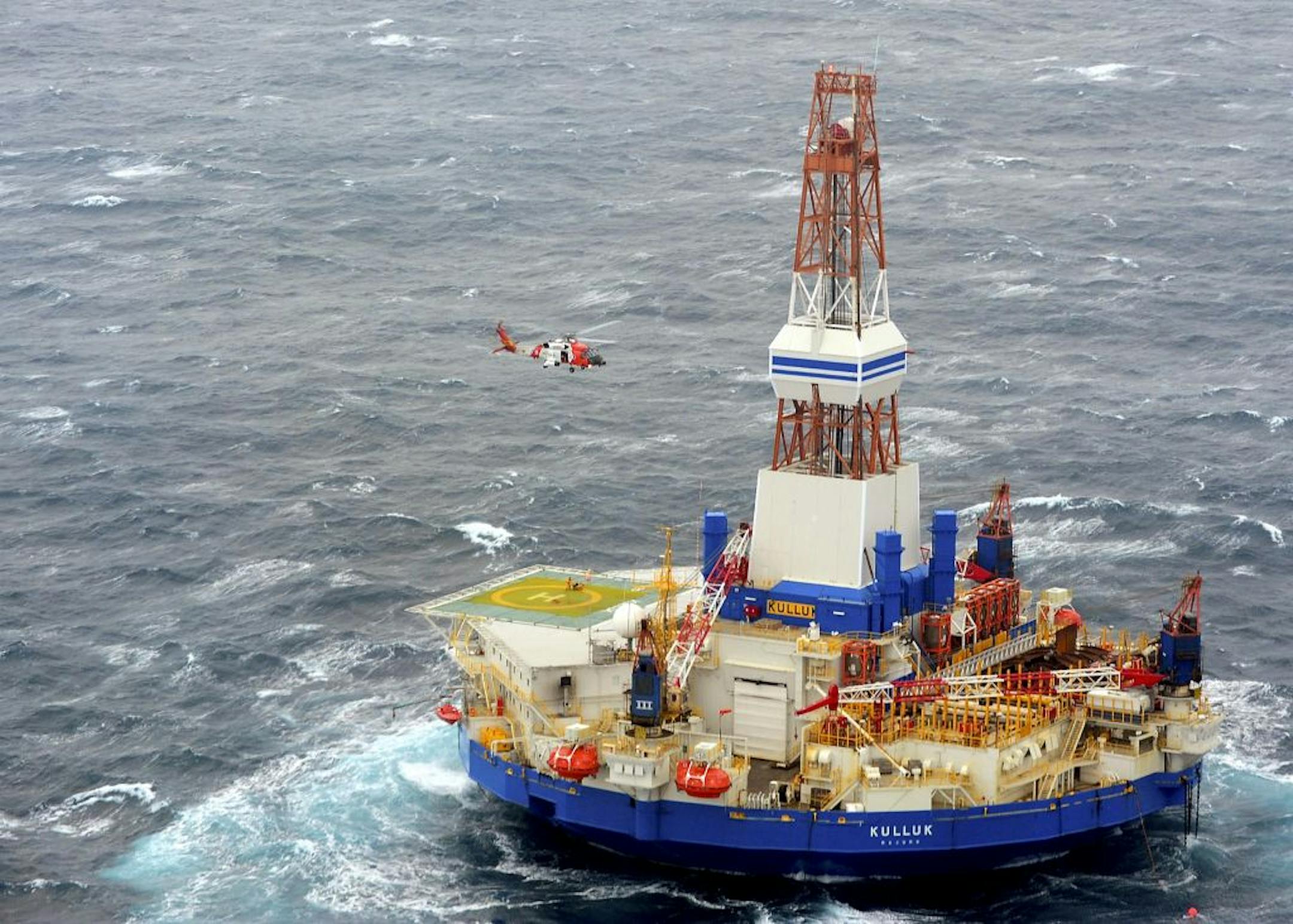 Crew members of Shell's mobile drilling unit, Kulluk, are rescued by the Coast Guard off the coast of Alaska, Dec. 29, 2012.