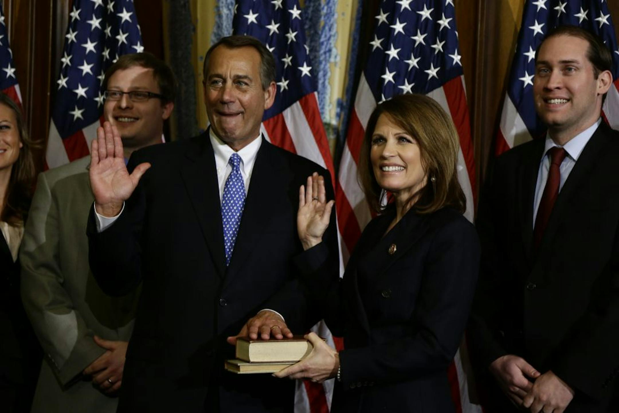 House Speaker John Boehner of Ohio performs a mock swearing in for Rep. Michele Bachmann, R-Minn., Thursday, Jan. 3, 2013, on Capitol Hill in Washington as the 113th Congress began.