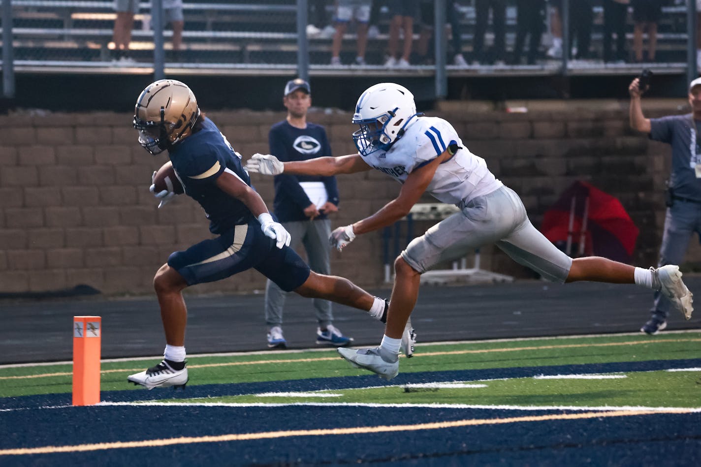 Chanhassen's Maxwell Woods (3) out runs Spring Lake Park defender Freddie Anthony, scoring on a six yard run to give the Storm a 13-0 lead. Photo by Cheryl A. Myers, SportsEngine