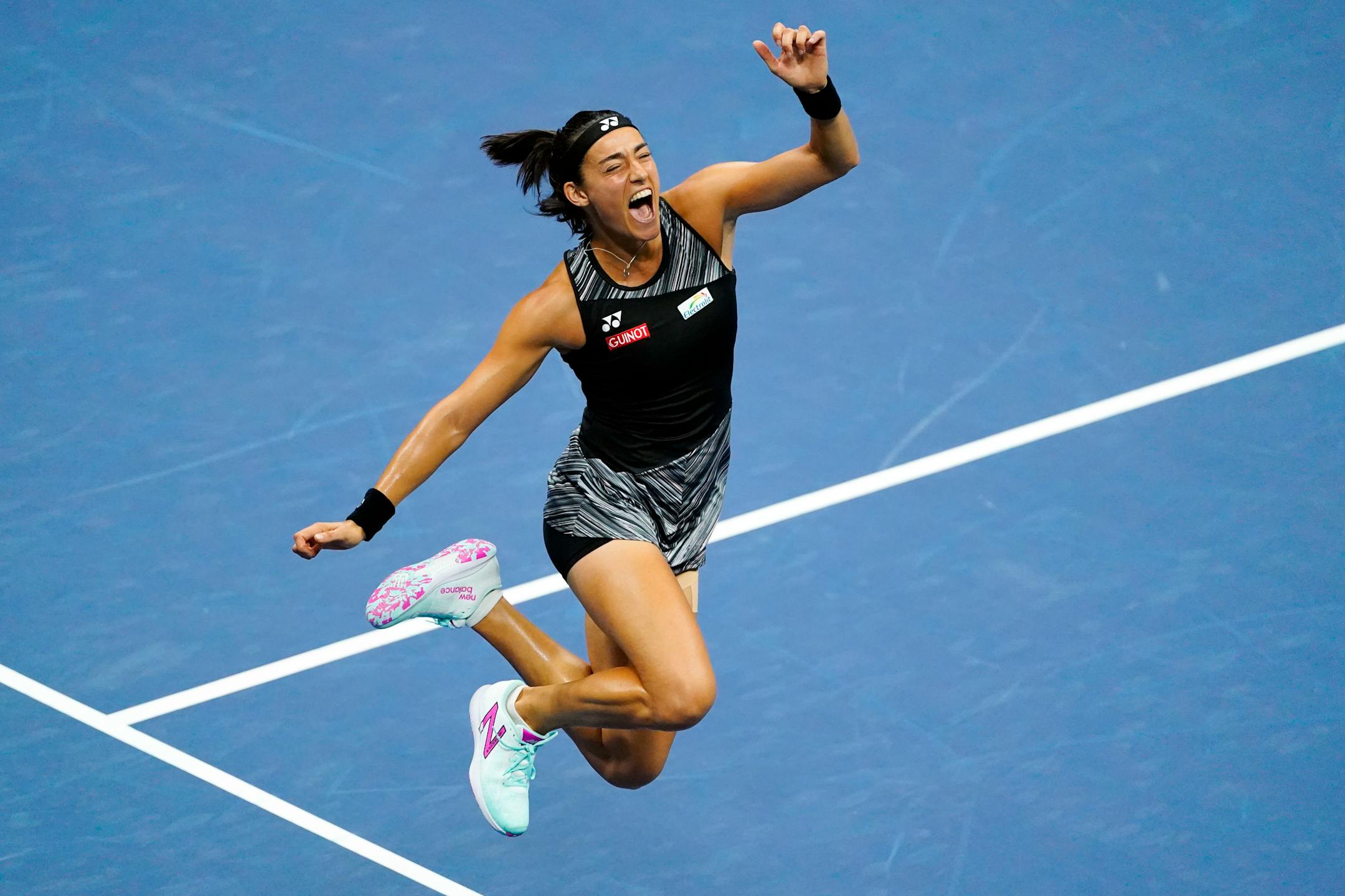 Caroline Garcia, of France, celebrates after defeating Coco Gauff, of the United States, during the quarterfinals of the U.S. Open tennis championships, Tuesday, Sept. 6, 2022, in New York. (AP Photo/Frank Franklin II)