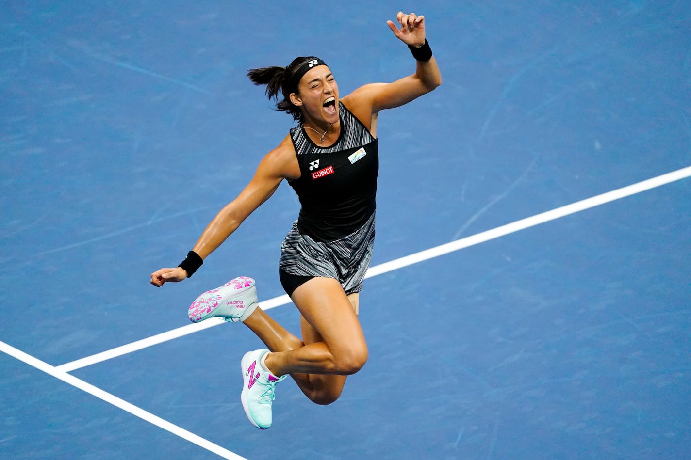 Caroline Garcia, of France, celebrates after defeating Coco Gauff, of the United States, during the quarterfinals of the U.S. Open tennis championships, Tuesday, Sept. 6, 2022, in New York. (AP Photo/Frank Franklin II)