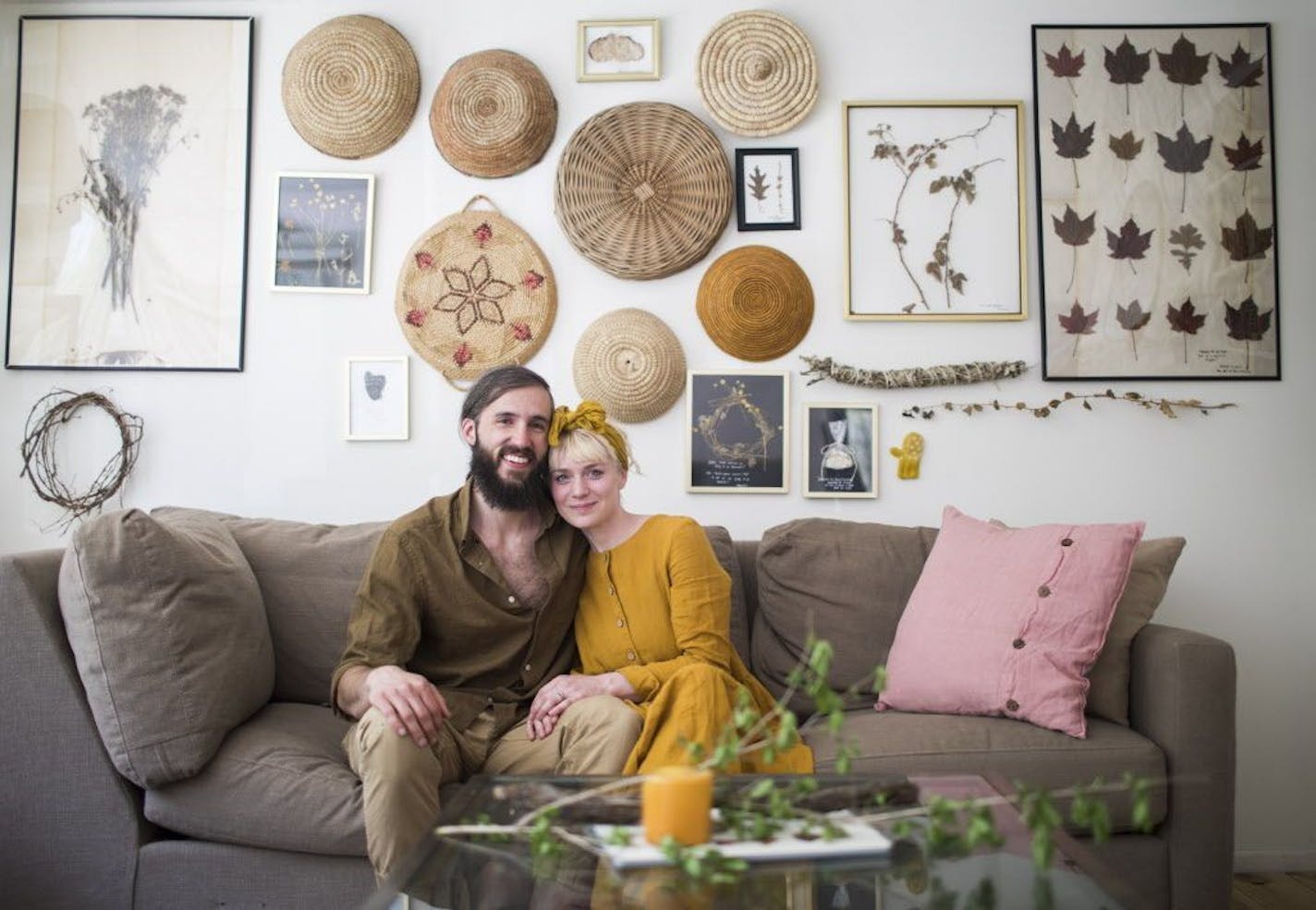 Johnna and Max Holmgren pose for a photo in their living room.