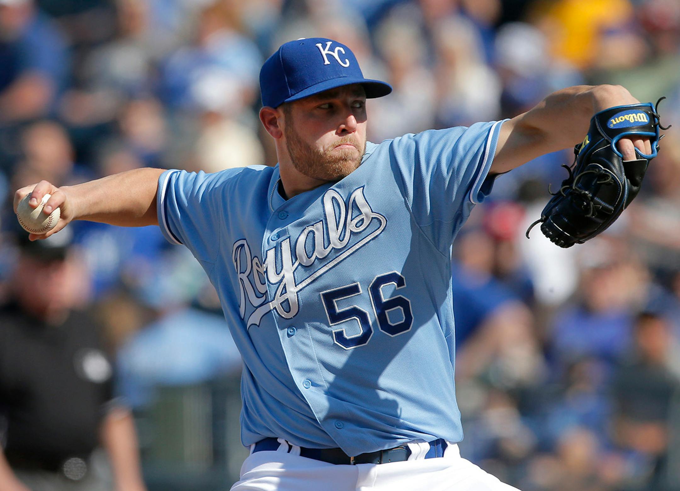 Kansas City Royals relief pitcher Greg Holland delivers to a Minnesota Twins batter during the ninth inning of a baseball game at Kauffman Stadium in Kansas City, Mo., Saturday, April 19, 2014. Holland registered his sixth save of the season as the Royals defeated the Twins 5-4. (AP Photo/Orlin Wagner)