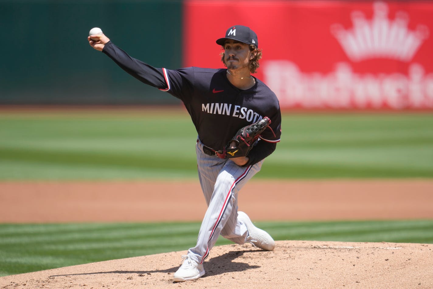 Minnesota Twins pitcher Joe Ryan works against the Oakland Athletics during the first inning of a baseball game in Oakland, Calif., Sunday, July 16, 2023. (AP Photo/Jeff Chiu)