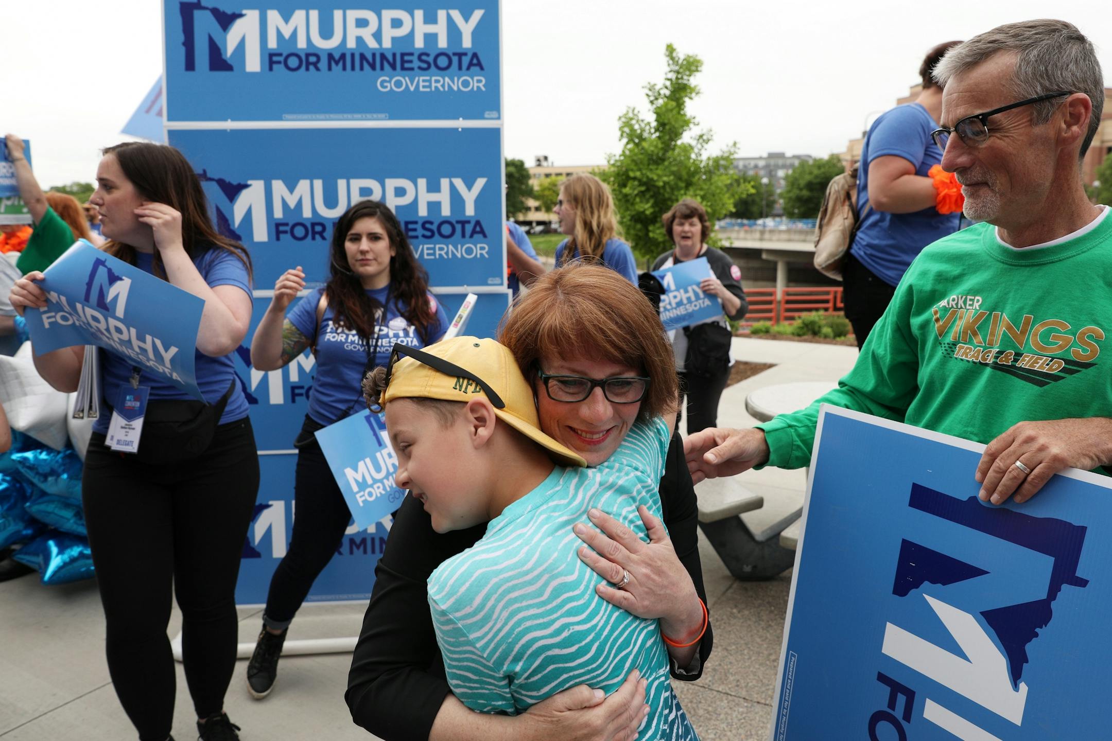 Gubernatorial candidate Erin Murphy gave a hug to her nephew following a rally Saturday morning.