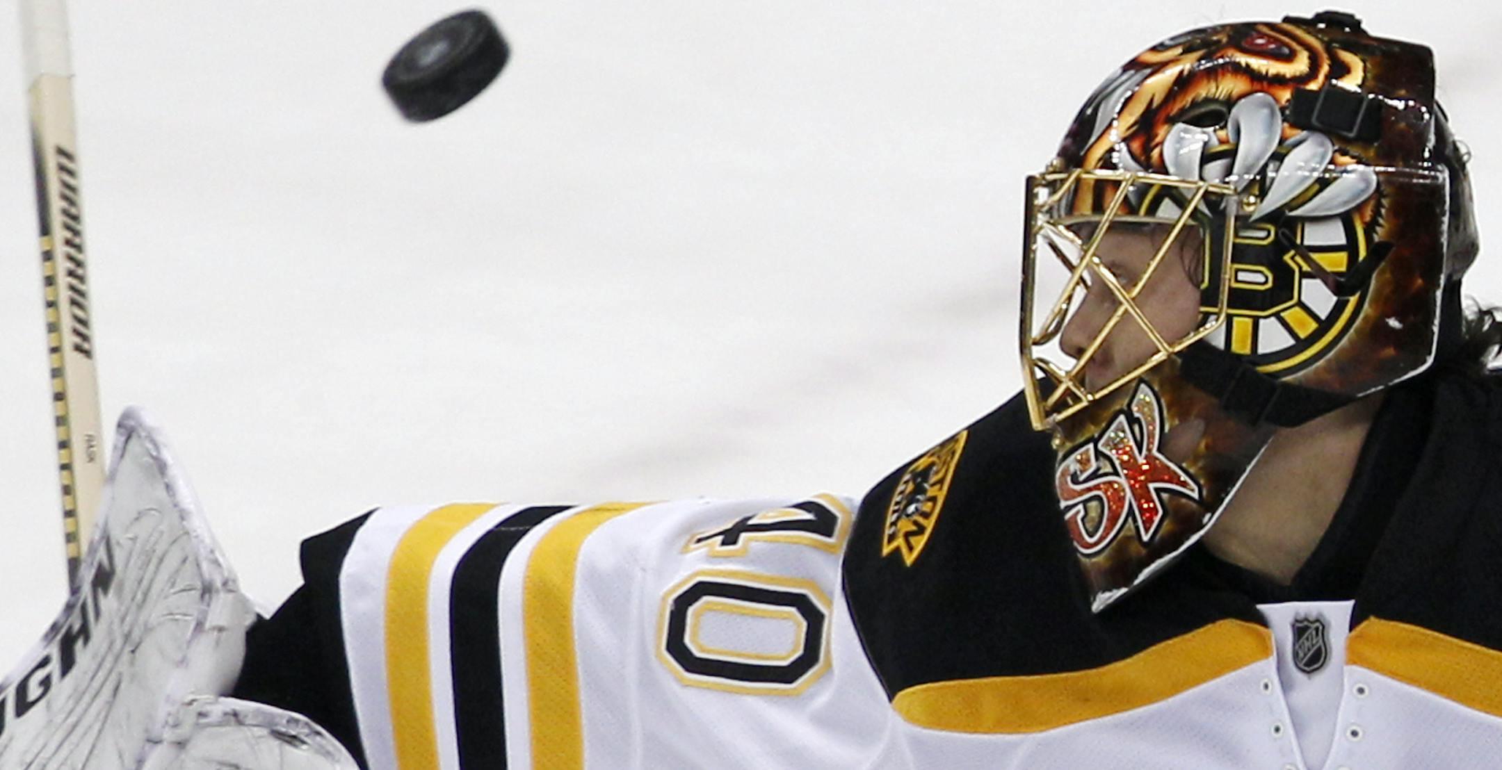 Boston Bruins goalie Tuukka Rask turns away a shot in the first period of an NHL hockey game against the Pittsburgh Penguins in Pittsburgh on Monday, Jan. 10, 2011. (AP Photo/Gene J. Puskar) ORG XMIT: PAGP102