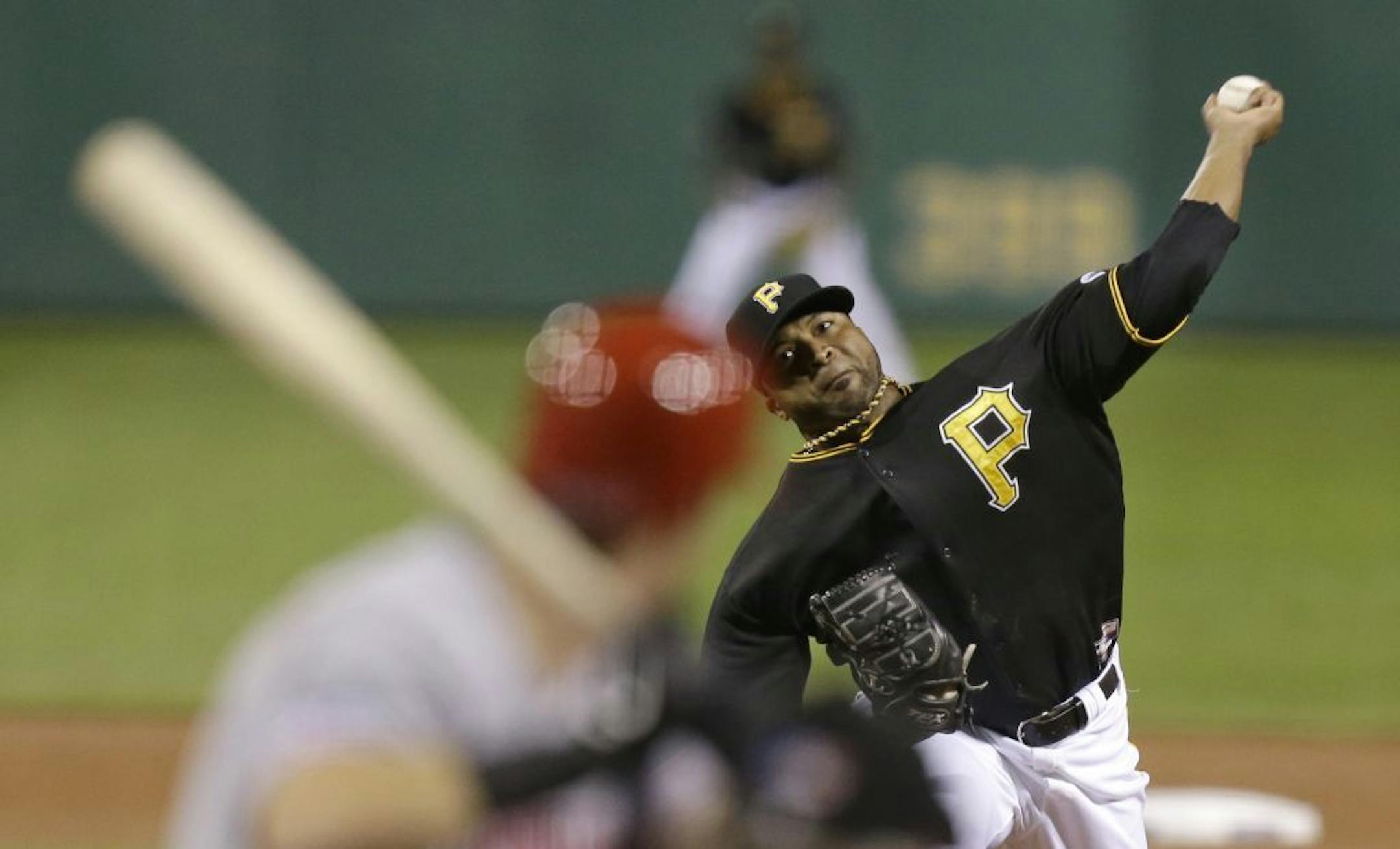 Pittsburgh Pirates starting pitcher Francisco Liriano throws against the Cincinnati Reds in the first inning of the NL wild-card playoff baseball game on Tuesday, Oct. 1, 2013, in Pittsburgh.