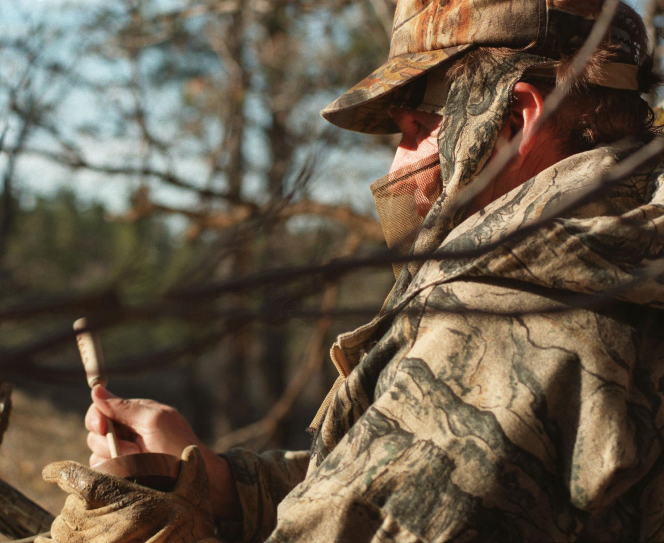 Ron Schara calls turkeys during a hunt in the Black Hills of South Dakota. ORG XMIT: MIN2014032709575311