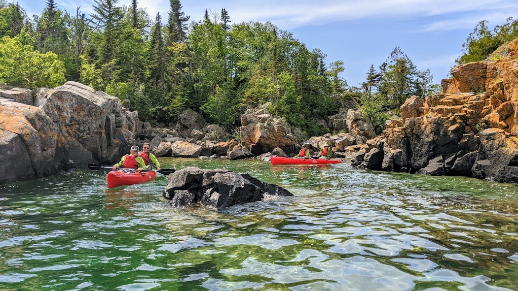 Cruise guests paddled through a passage off Shangoina Island on Lake Superior near Silver Islet, Ontario.