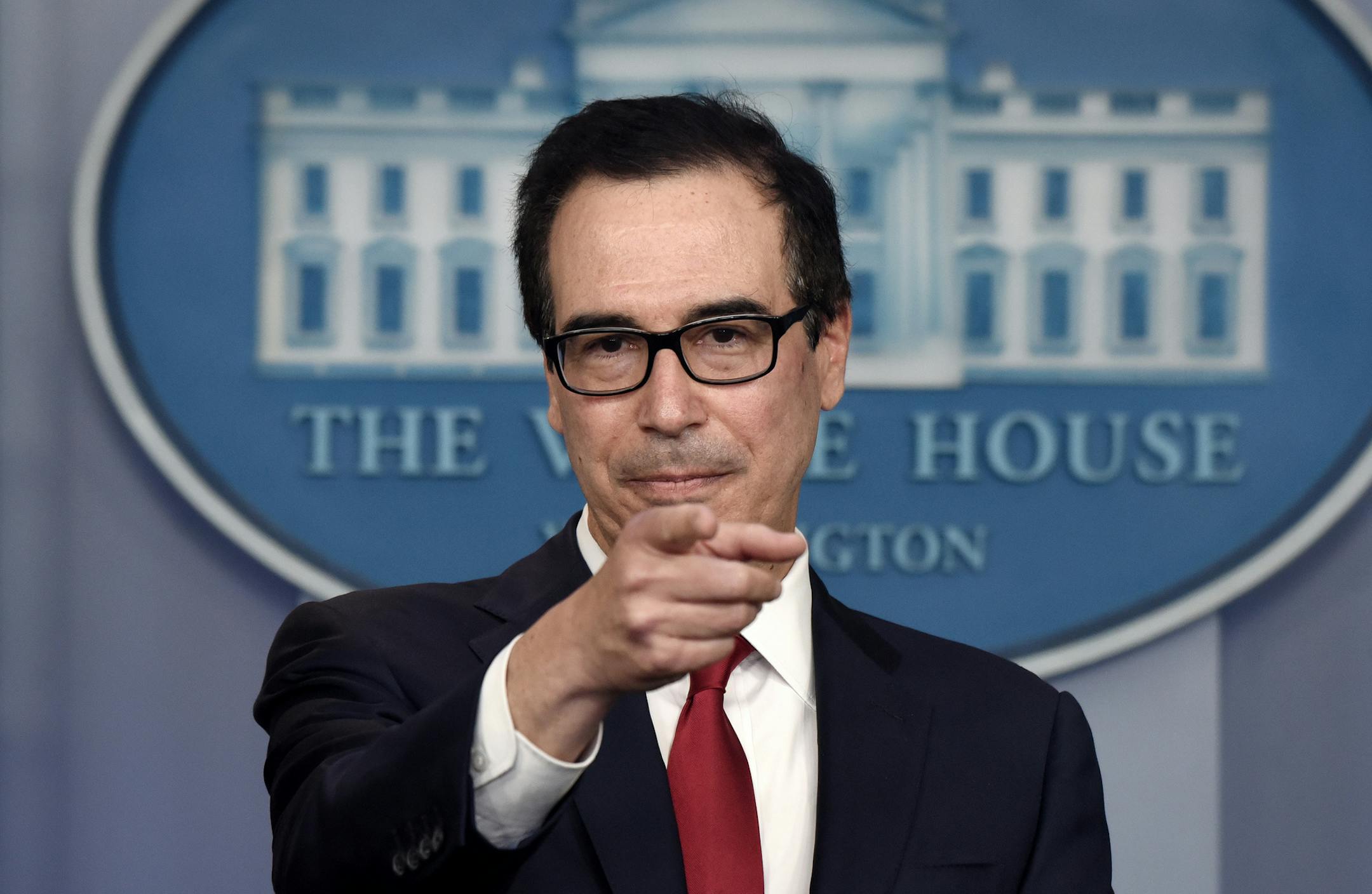 Treasury Secretary Steven Mnuchin speaks in the James Brady Briefing Room to discuss regulatory issues associated with cryptocurrency, at the White House in Washington, DC, on July 15. 2019. Mnuchin alleged that Amazon.com Inc. has "limited competition" and harmed the retail industry as the Trump administration announced a broad antitrust review into whether technology companies are using their power to thwart rivals.(Olivier Douliery/ Abaca Press/TNS) ORG XMIT: 1371037