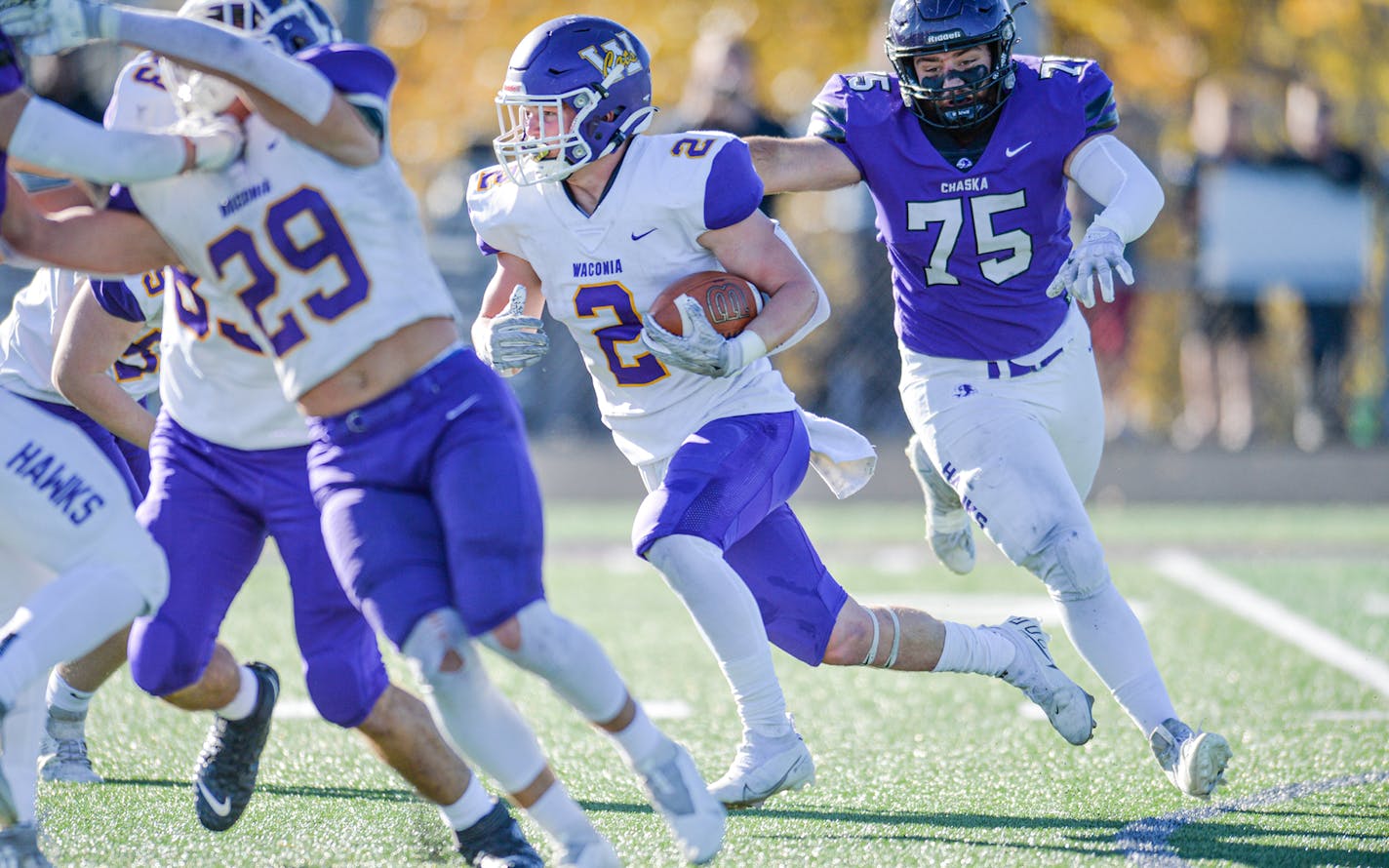 Waconia's quarterback Max McEnelly carries the ball up the middle in the first quarter. Photo by Earl J. Ebensteiner, SportsEngine ORG XMIT: MIN2110301624170023