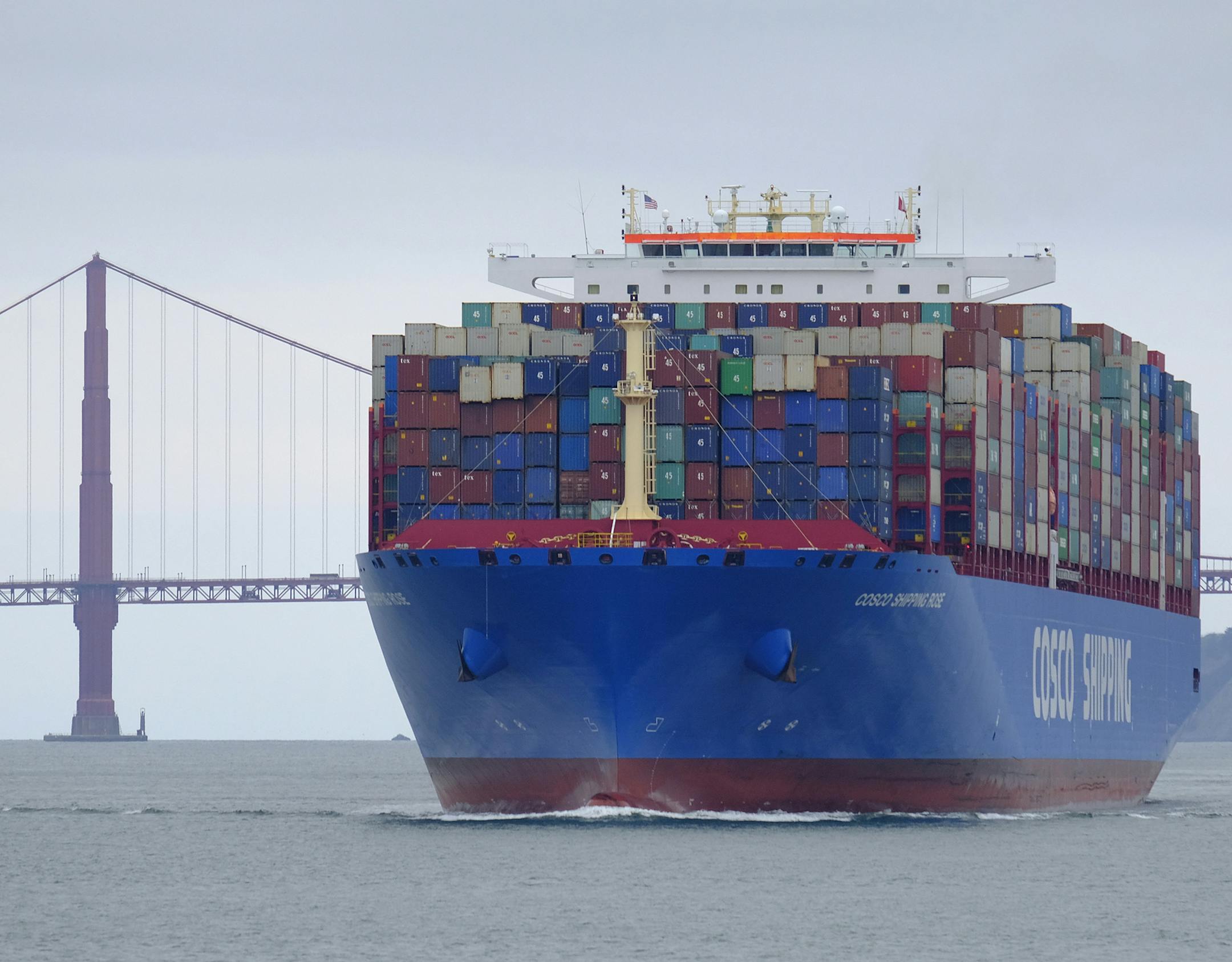 A Cosco Shipping container ship passes the Golden Gate Bridge Tuesday, May 14, 2019, in San Francisco bound for the Port of Oakland. The United States and China are raising tariffs on tens of billions of dollars' worth of each other's imports, escalating a trade war, spooking financial markets and casting gloom over the prospects for the world economy. (AP Photo/Eric Risberg) ORG XMIT: FX202