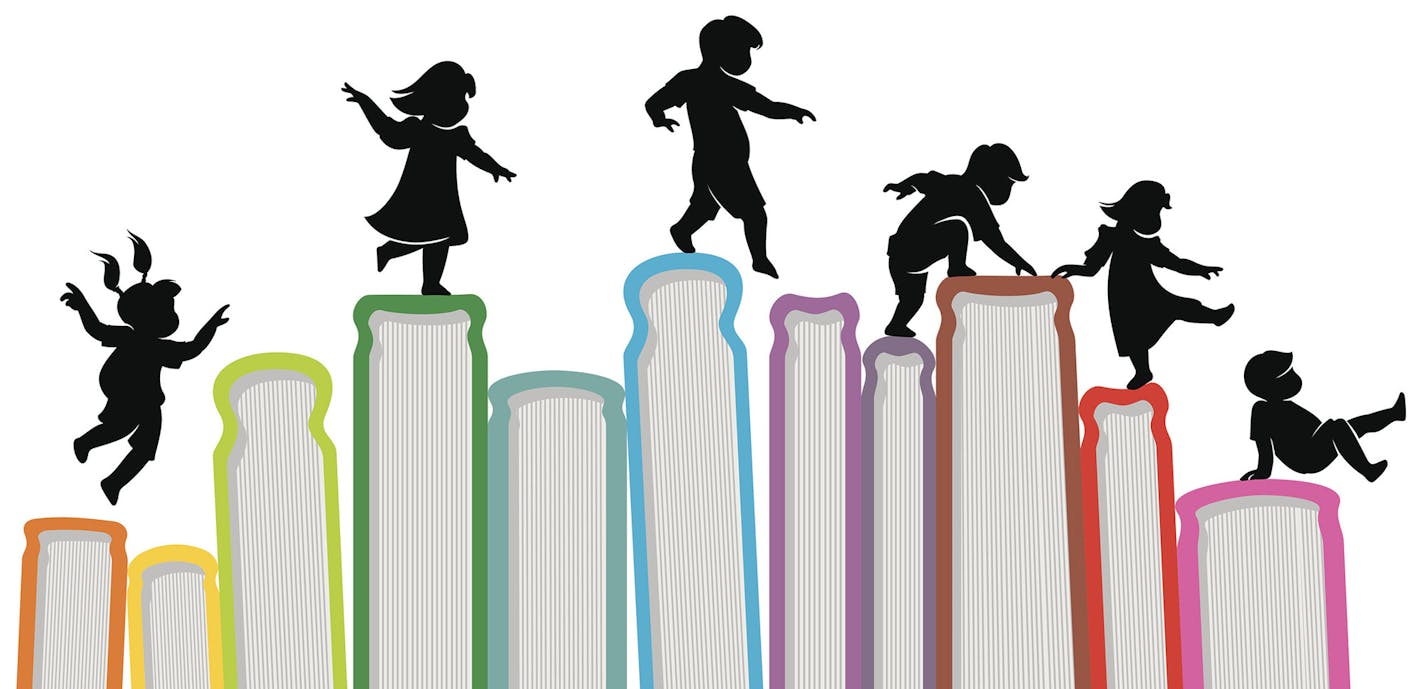 iStockphoto.com
Children silhouette on top of upright books.