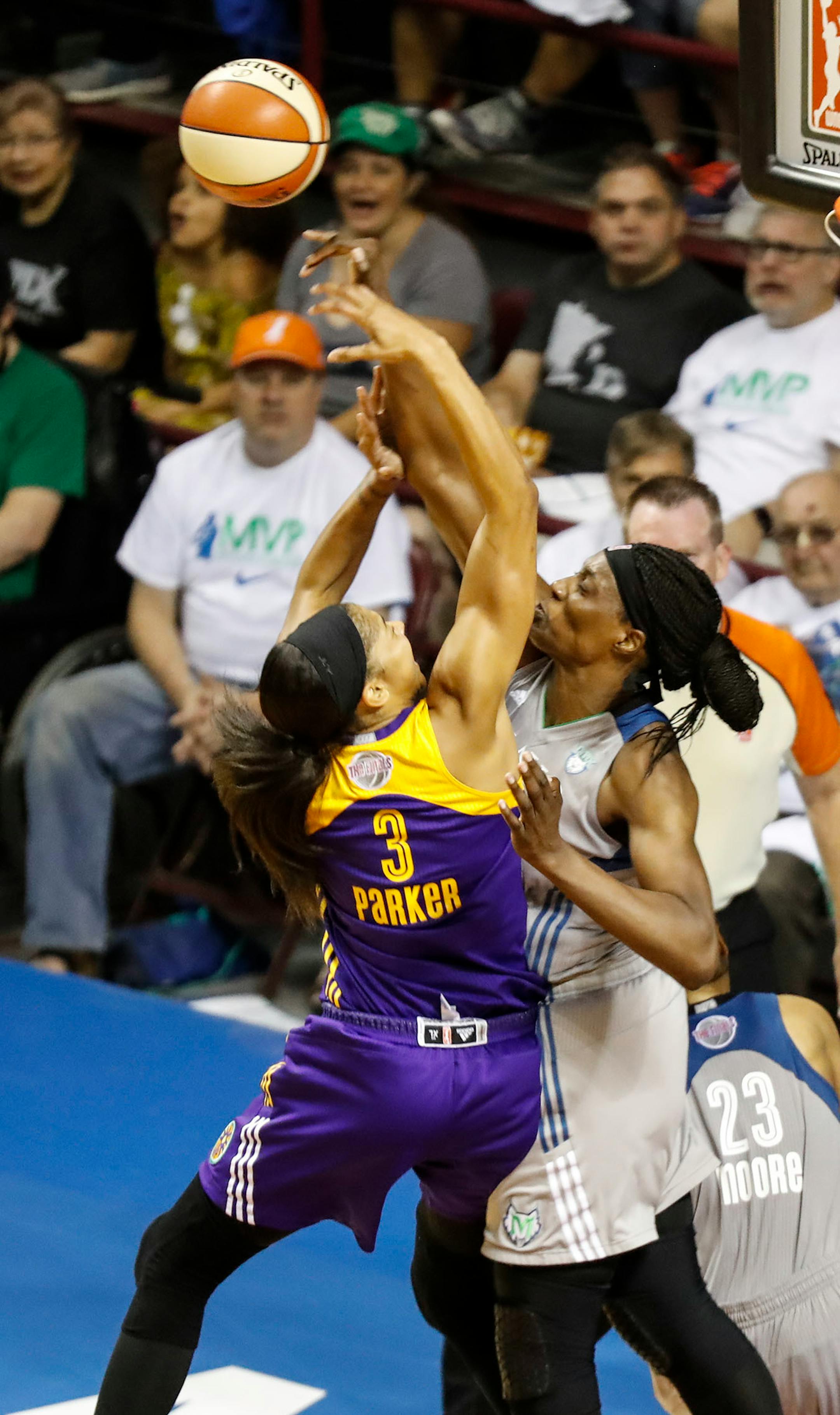 Minnesota Lynx center Sylvia Fowles (34) knocked a rebound out Los Angeles Sparks forward Candace Parker's (3) hands in the second half. The Sparks won 85-84.